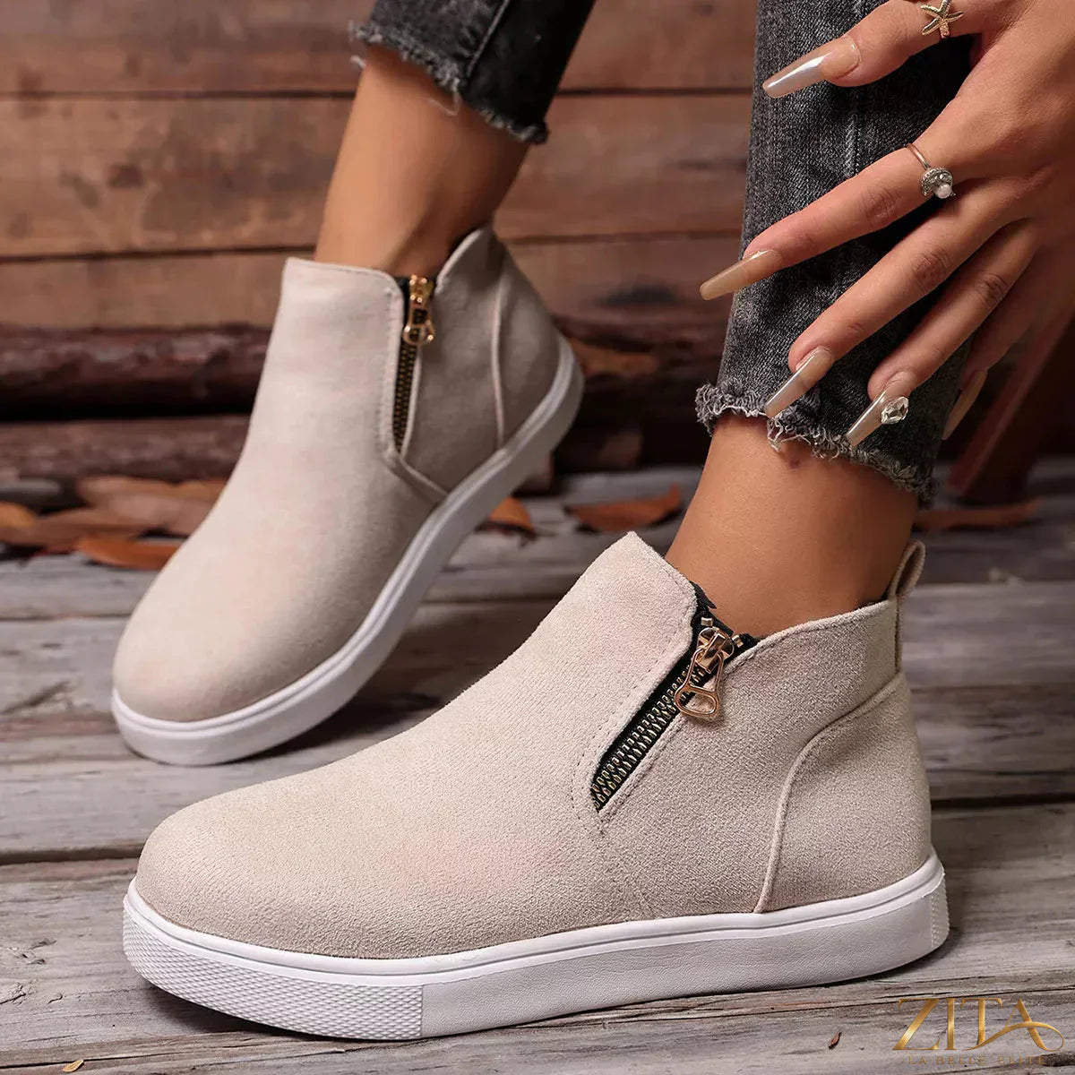 Zita La Belle Elite side zipper flat sneakers with sleek design and comfortable fit, featuring a white and black color scheme.