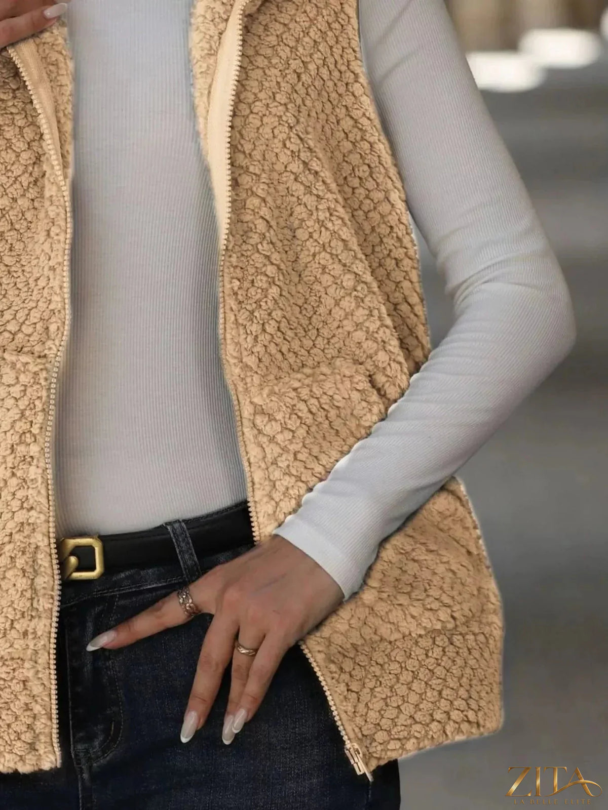 Zita La Belle Elite zip-up vest coat in neutral fabric, featuring a high collar and sleek design for casual or outdoor wear.