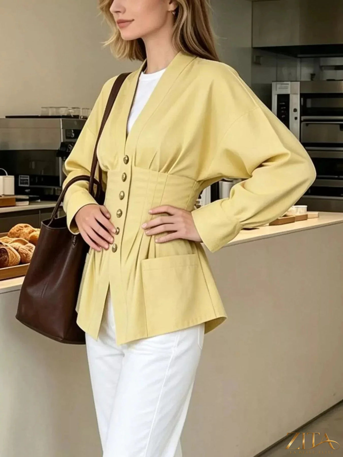 Zita La Belle Elite pleated waist blouse with button details, featuring a stylish, flowy fabric and elegant design.