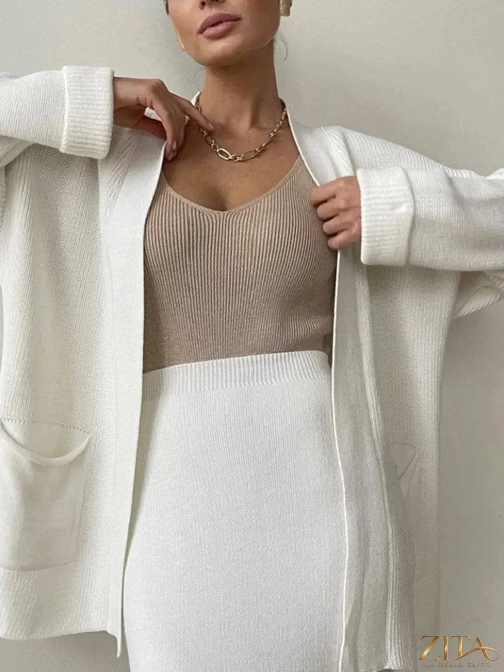 Zita La Belle Elite pocketed long sleeve cardigan and skirt sweater set, soft knit fabric, with pockets and matching design.