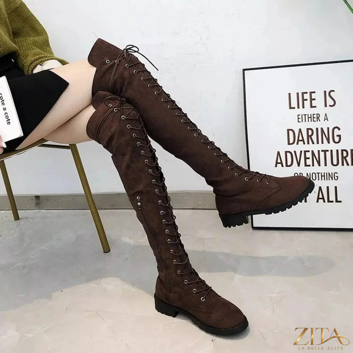 Over-the-knee lace-up boots from Trendsi featuring a sleek design with a pointed toe and stiletto heel.
