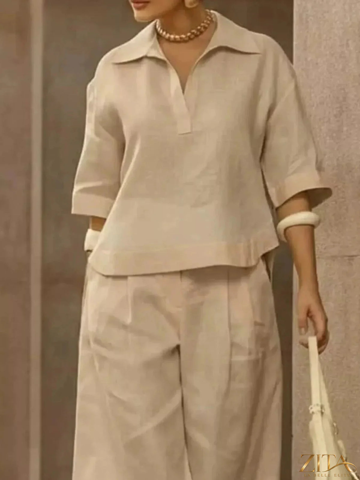Plus size Zita La Belle Elite two-piece set with 3/4 sleeve top and wide-leg pants, shown in a full-length view.