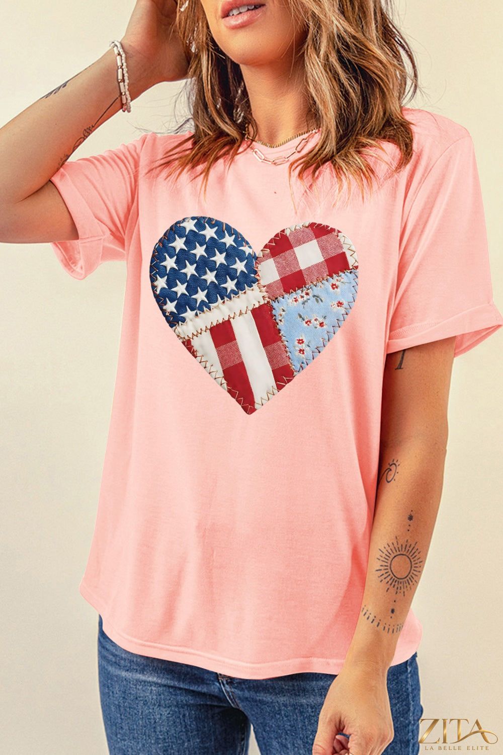 Red and white patriotic heart round neck T-shirt by Trendsi, featuring a bold heart design on the front.