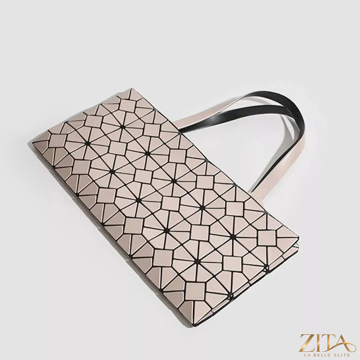 Zita La Belle Elite geometric lattice pattern handbag with structured design and top handle, showcasing intricate cutout details.