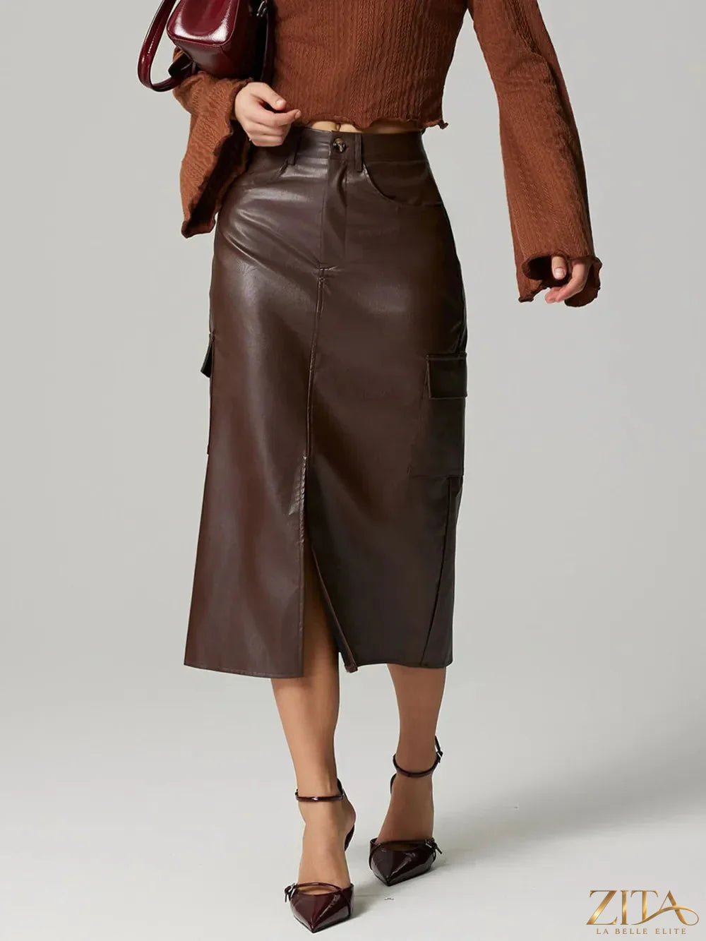 Trendsi slit midi skirt with pockets, featuring a stylish design and side slit details, perfect for casual or dressy outfits.