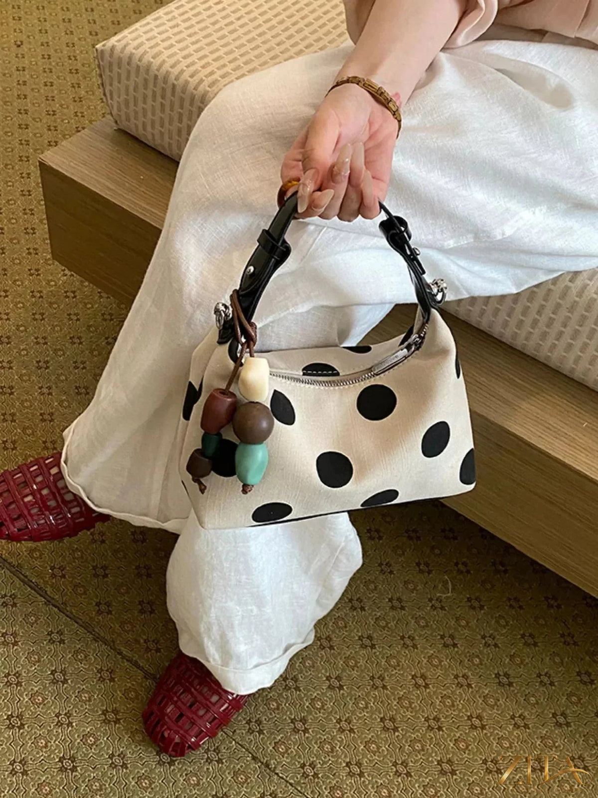 Polka dot PU leather handbag by Zita La Belle Elite with a stylish design and adjustable strap, featuring a spacious interior and classic pattern.