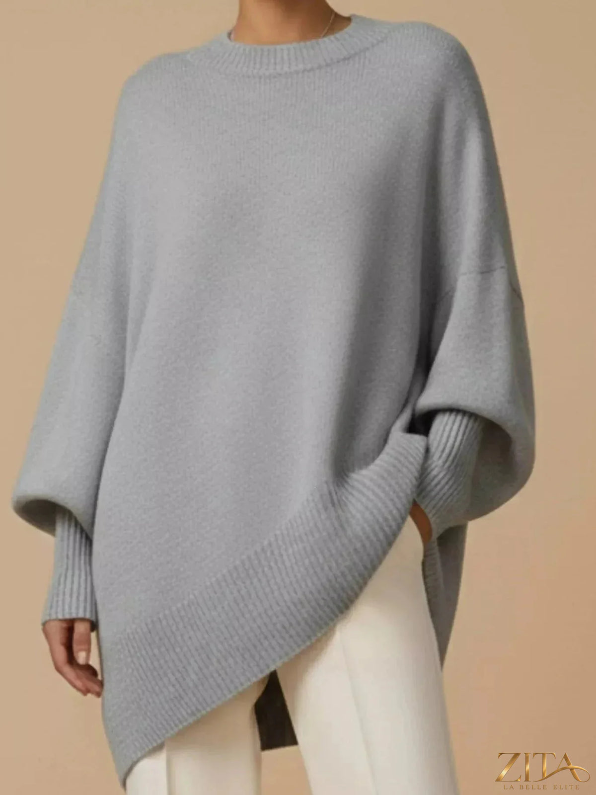 Oversized dropped shoulder sweater by Trendsi, soft knit fabric, relaxed fit, long sleeves, and cozy design.