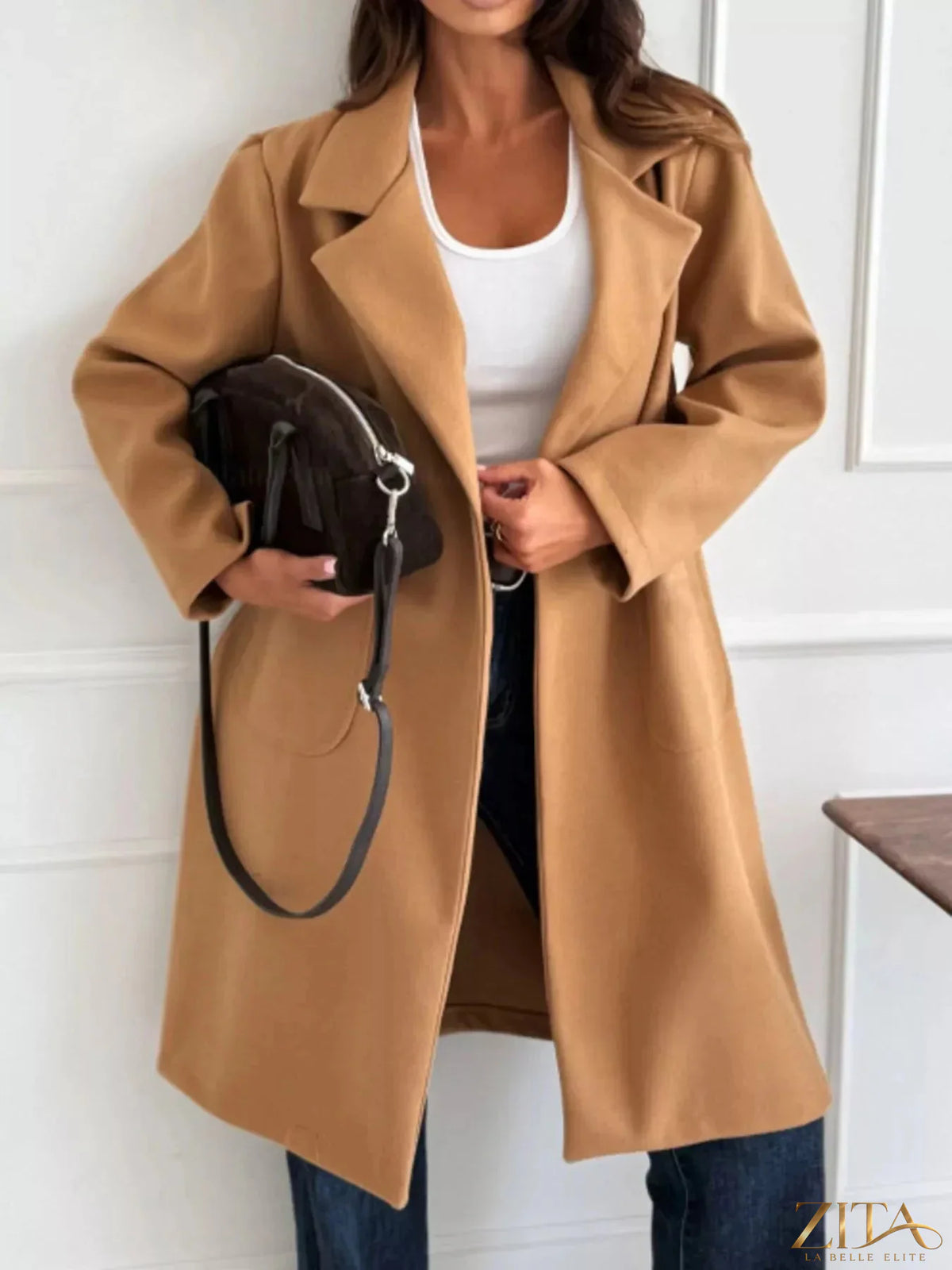 Zita La Belle Elite long-sleeve single-breasted trench coat in neutral fabric, displayed on a hanger.