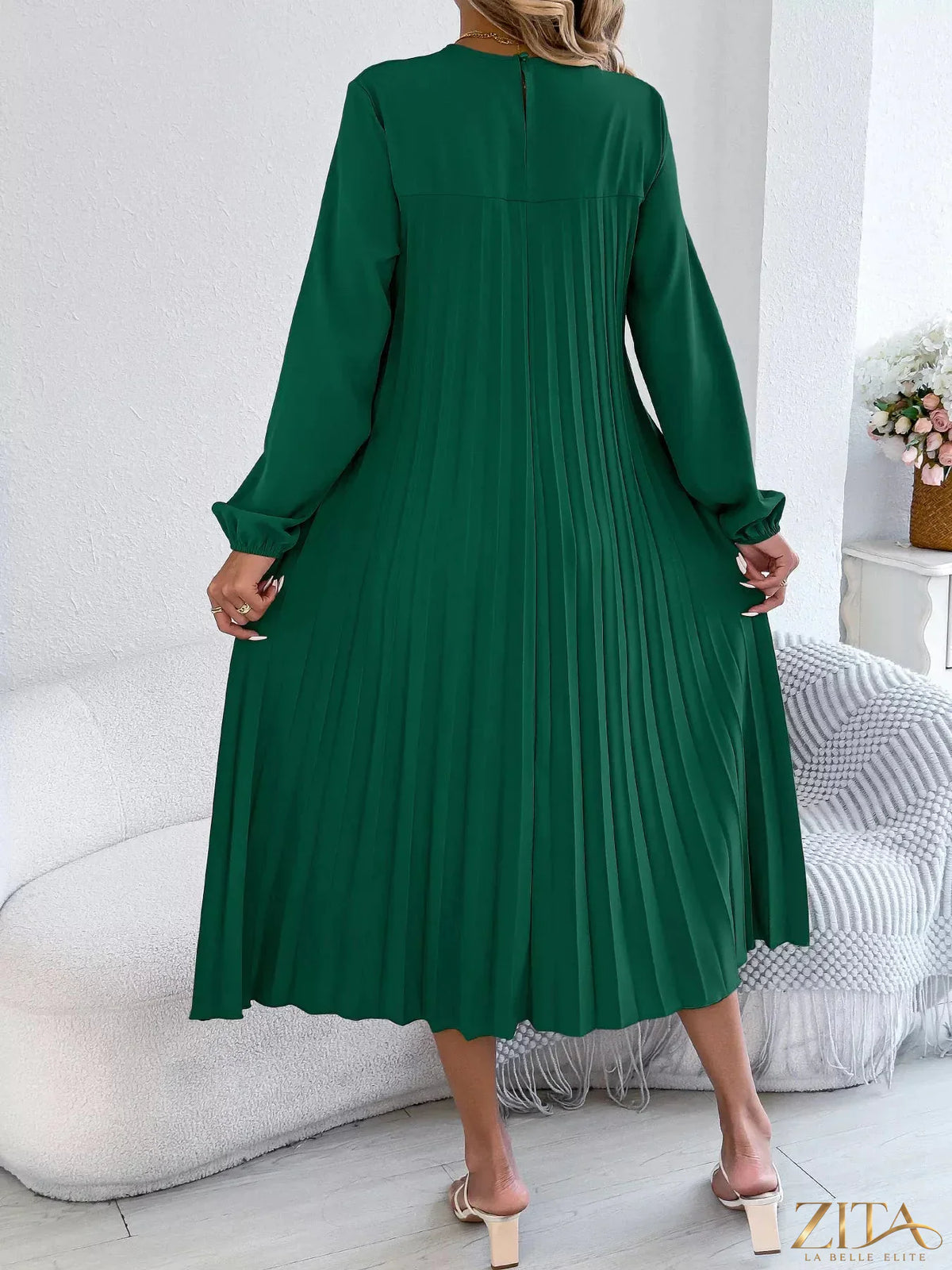Zita La Belle Elite pleated A-line midi dress with a flowy silhouette and elegant design, shown on a model.