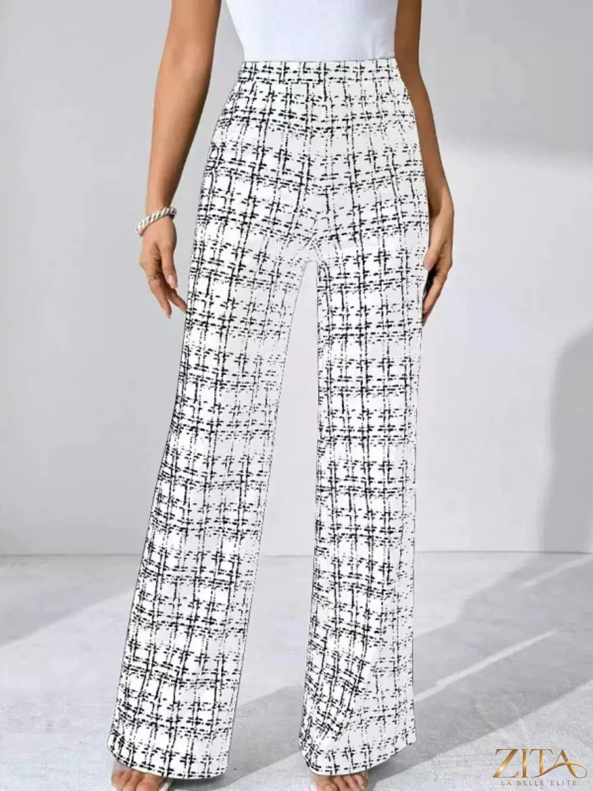 Zita La Belle Elite plaid wide-leg pants with high waist and relaxed fit, featuring a stylish tartan pattern and tapered legs.