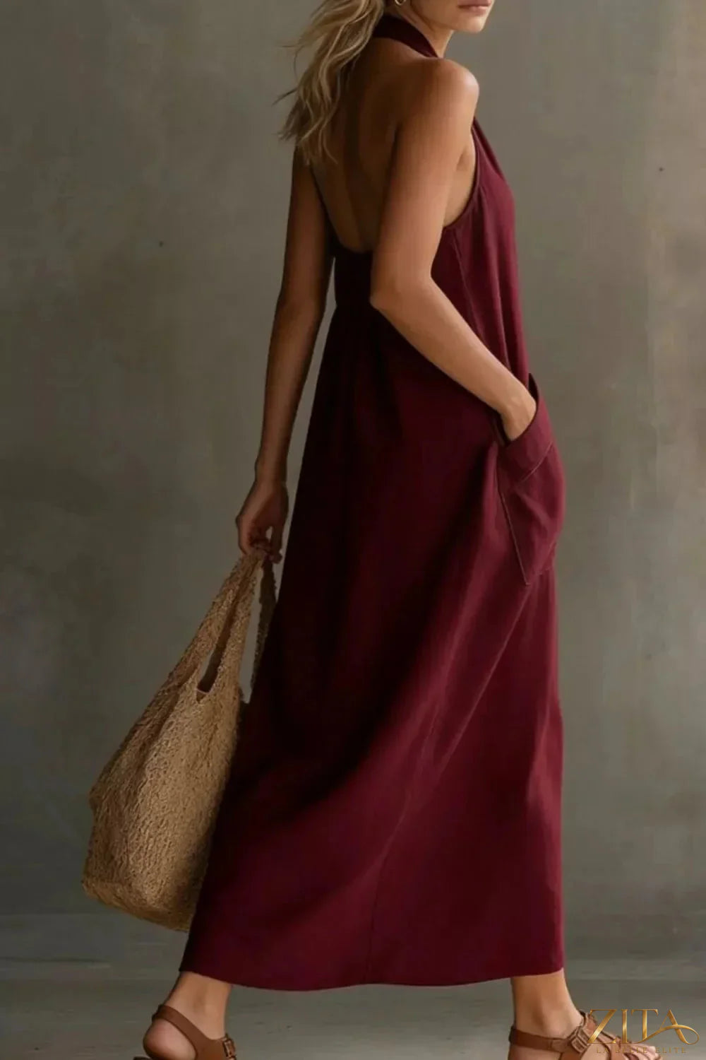 Casual Zita La Belle Elite halter neck midi dress with front pockets, sleeveless design, and relaxed fit for warm weather.