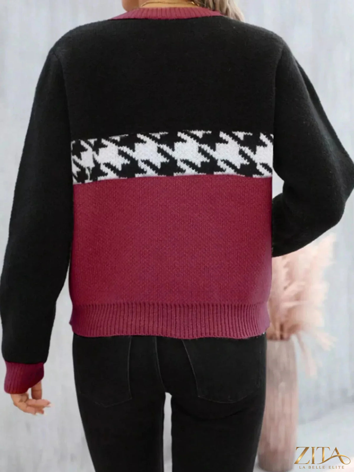 Color block houndstooth sweater from Trendsi featuring a stylish knit design with bold color blocks and a classic houndstooth pattern.