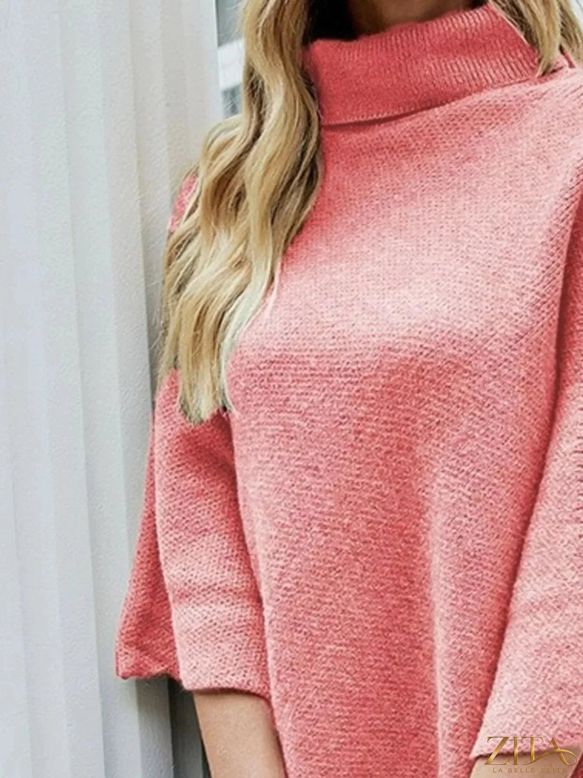 Zita La Belle Elite button-decor turtleneck poncho pullover in cozy knit fabric with decorative buttons and a relaxed fit.