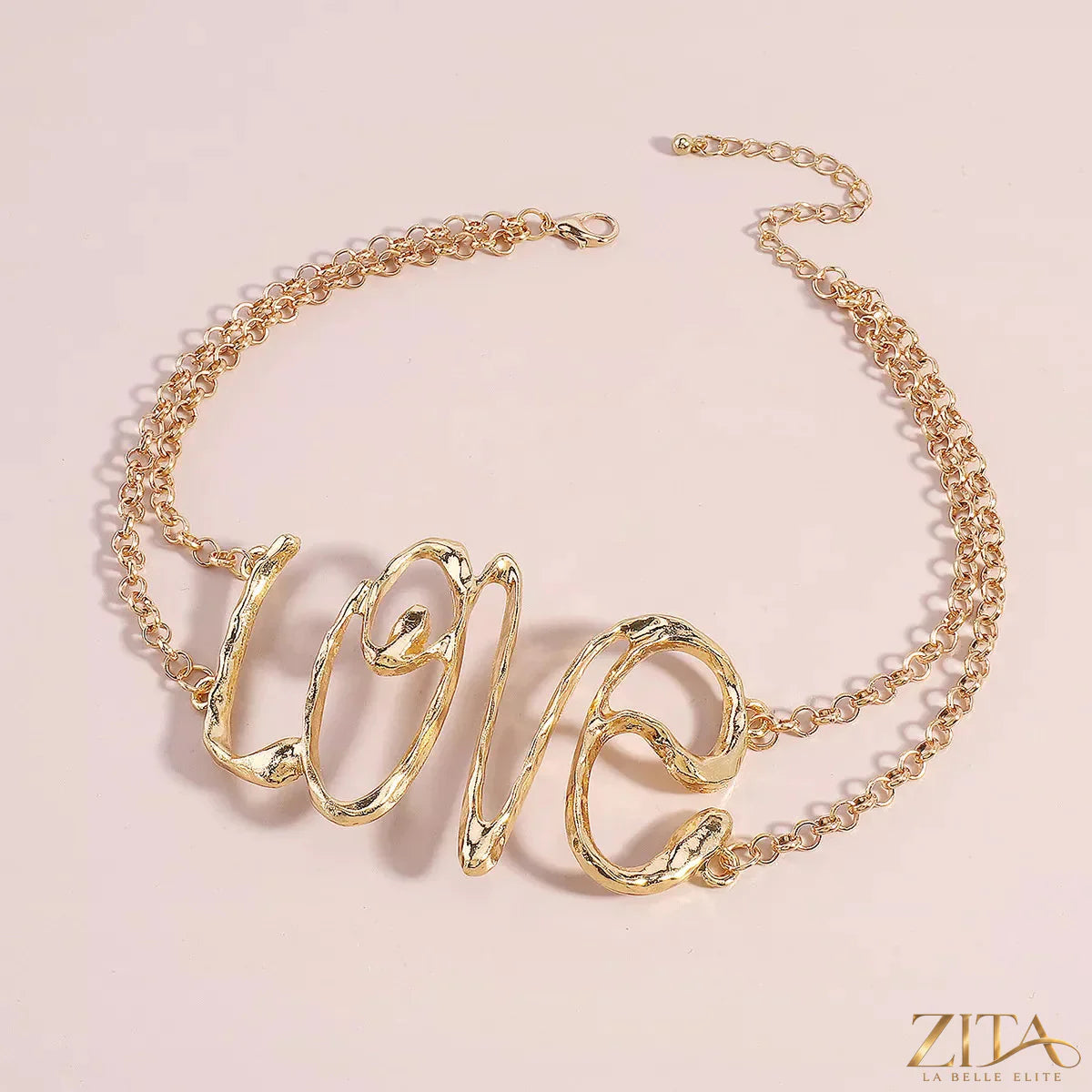 Gold wire love script statement necklace by Zita La Belle Elite featuring elegant, handcrafted love-shaped wire design.