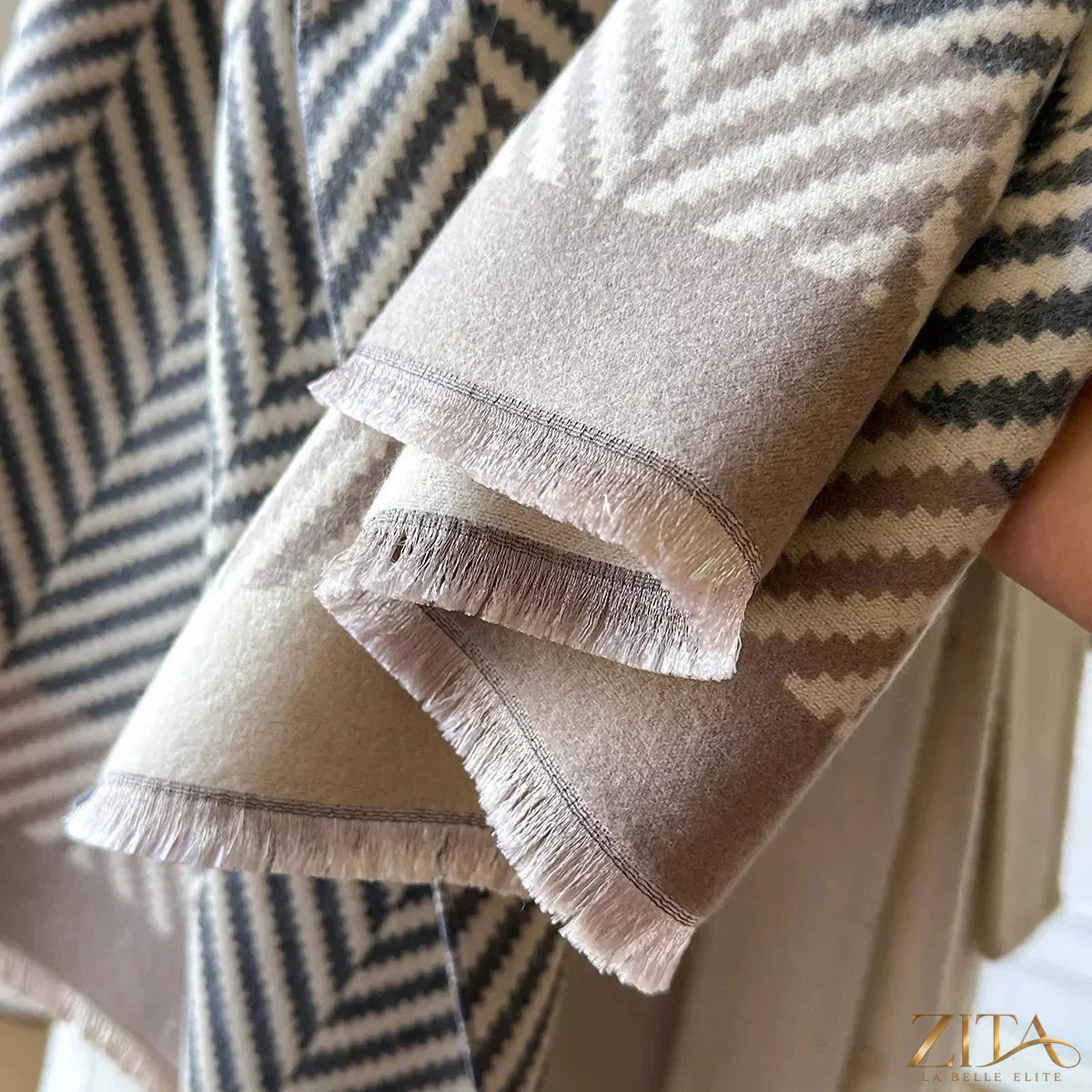 Soft raw hem scarf by Zita La Belle Elite, featuring lightweight fabric and stylish raw edge details for a fashionable look.