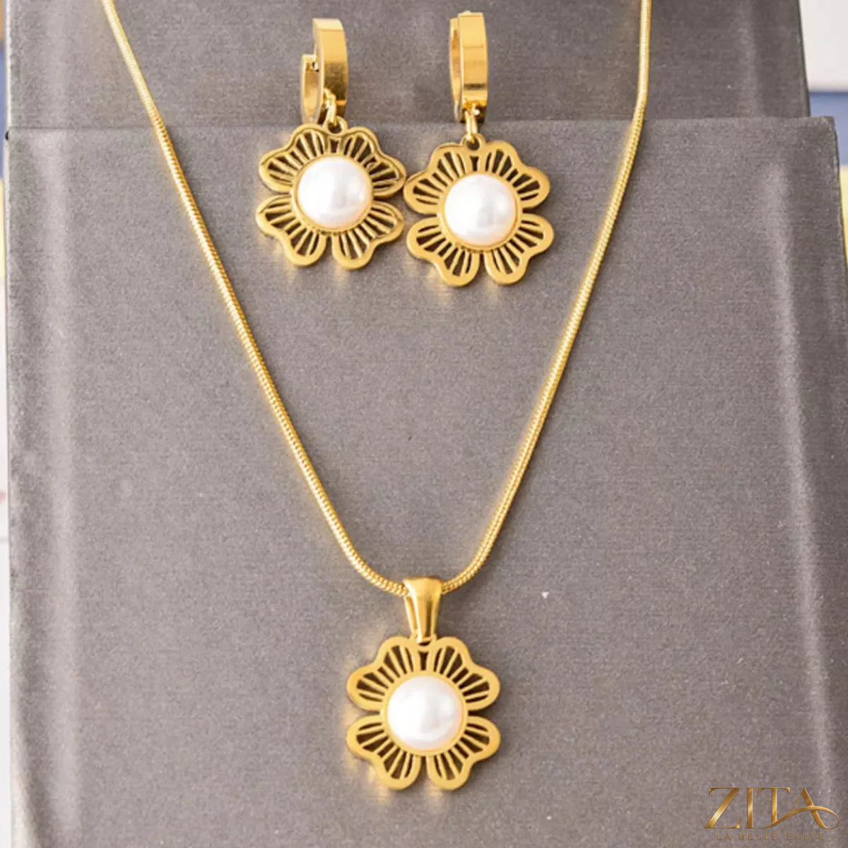 18K gold-plated flower jewelry set featuring a necklace and earrings with intricate floral design and sparkling accents.