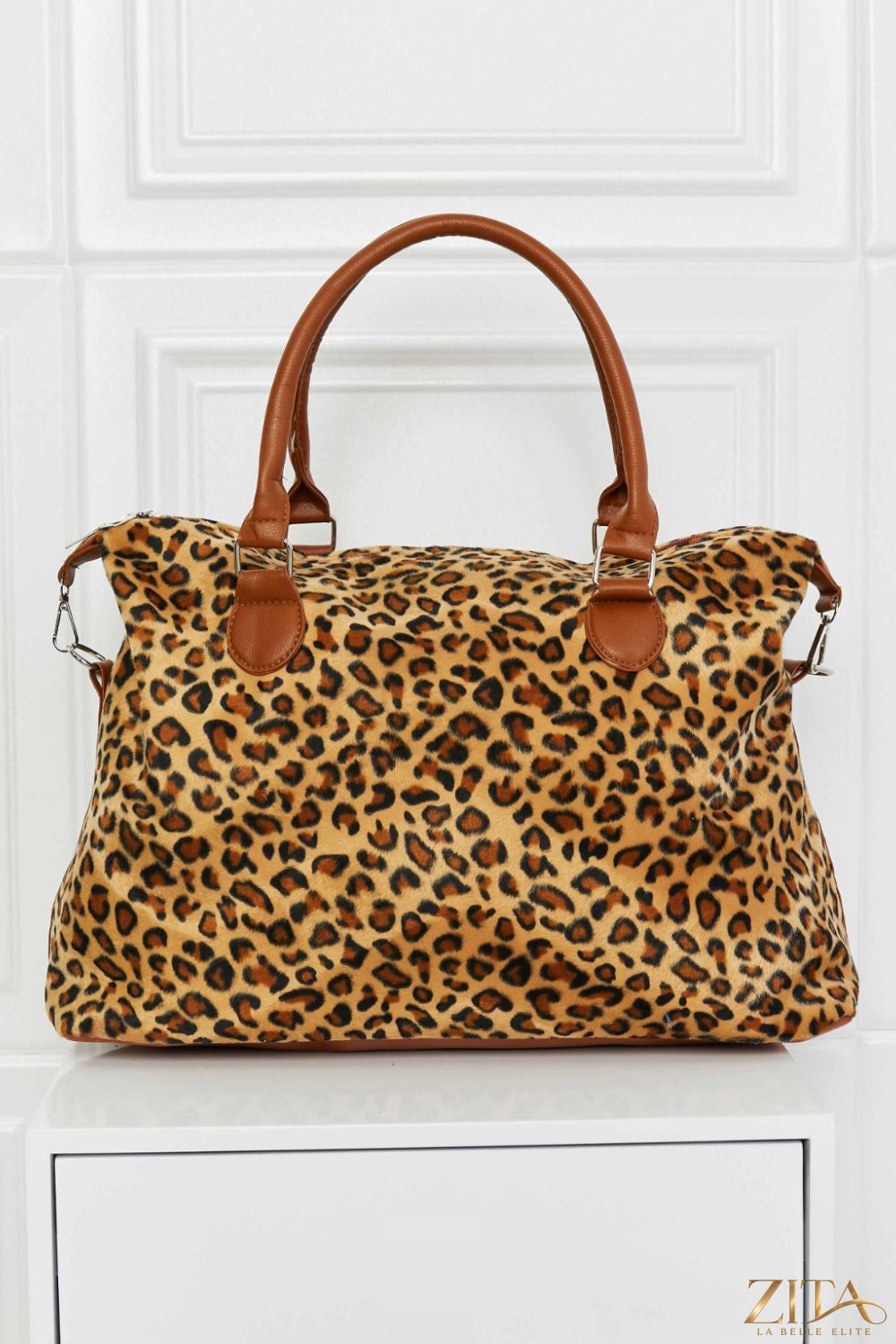 Animal print brushed weekender bag by Zita La Belle Elite with sturdy handles and spacious interior for travel or overnight trips.