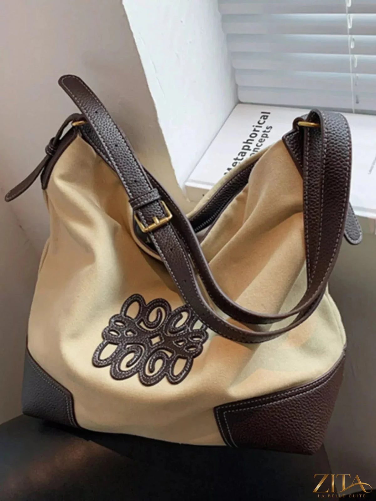 Embroidered canvas tote bag by Zita La Belle Elite with floral design, sturdy handles, and spacious interior for everyday use.