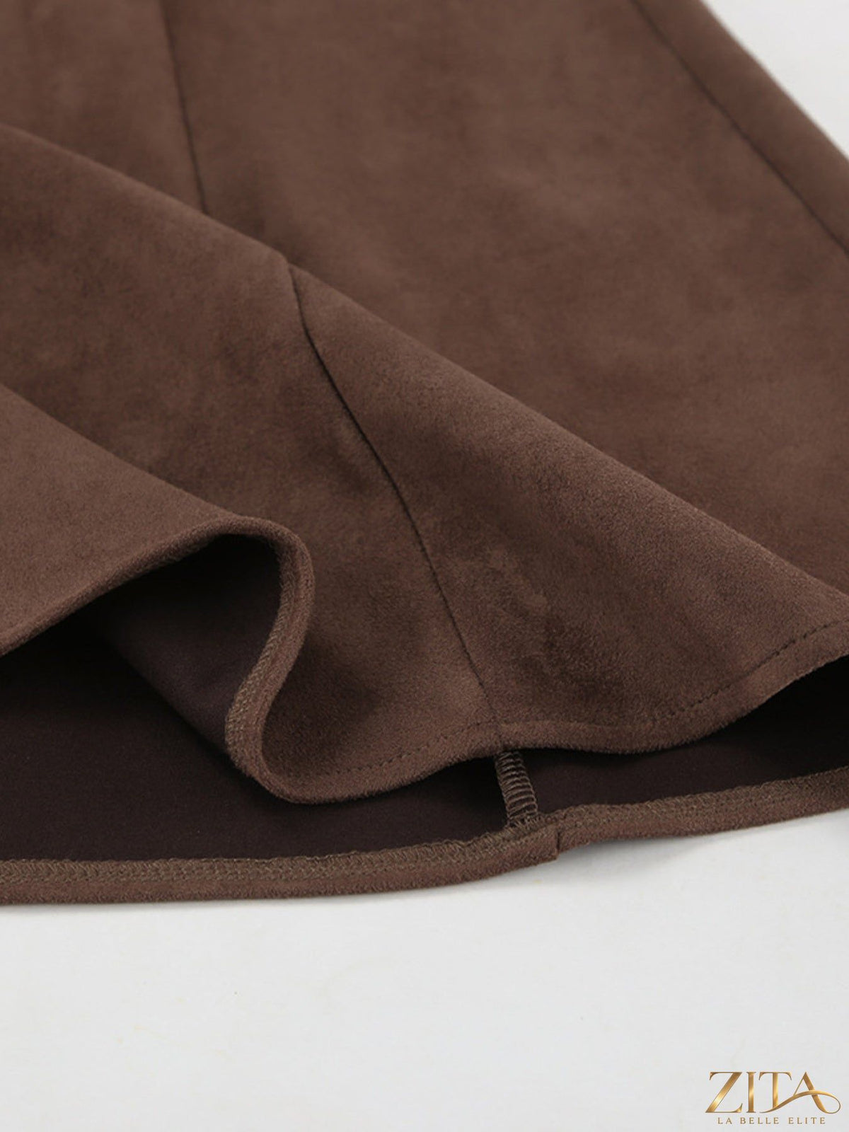 Tan suede midi skirt from Trendsi featuring a high waist and flowy silhouette, shown on a hanger.