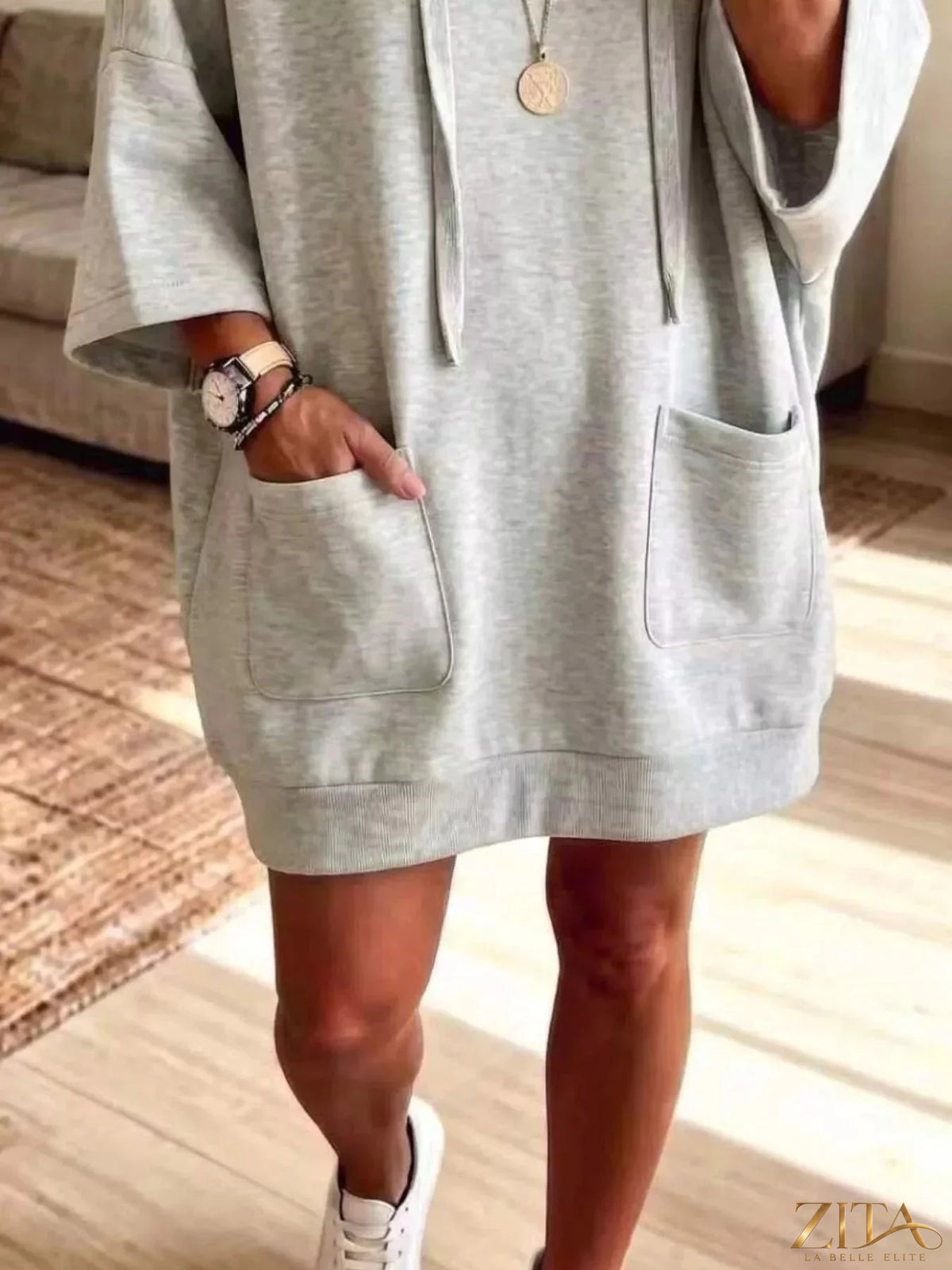 Plus size oversized drawstring hoodie with front pockets from Zita La Belle Elite, shown in a relaxed fit with a hood and casual style.