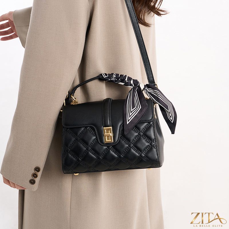 Quilted leather crossbody bag by Trendsi with a sleek design, featuring a front flap and adjustable strap for everyday use.
