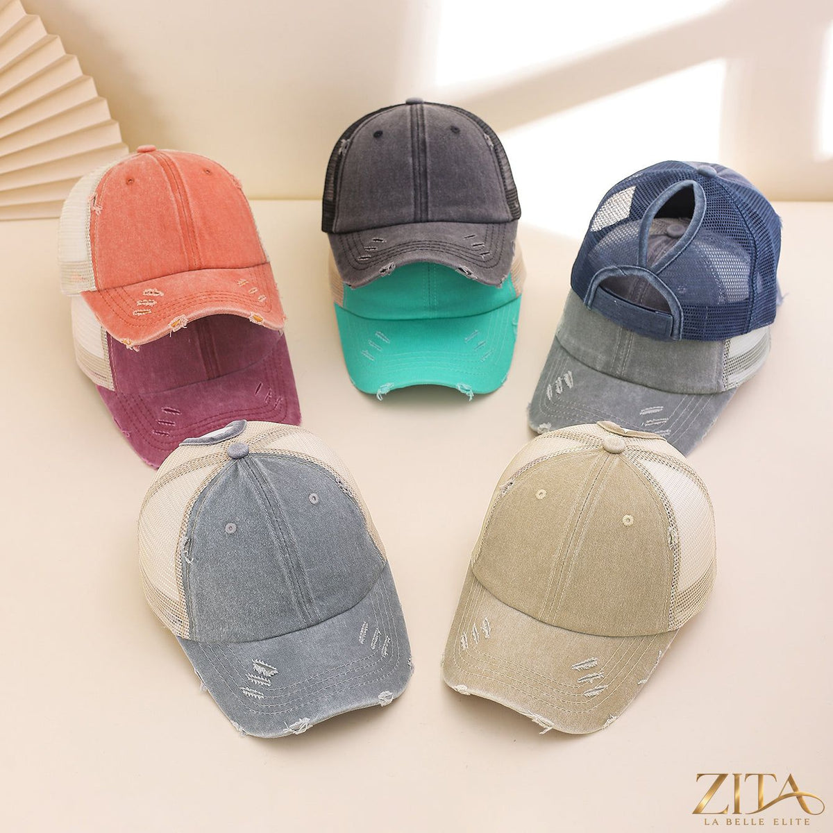 Distressed washed mesh baseball cap by Zita La Belle Elite featuring a casual, worn-in style and breathable mesh panels.