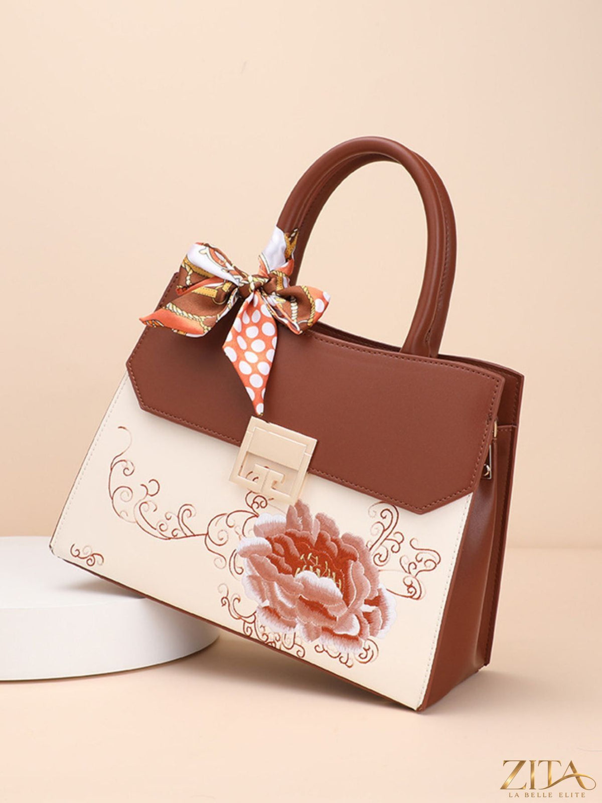 Zita La Belle Elite floral top handle handbag with colorful flower pattern and structured design, featuring a sturdy top handle and spacious interior.