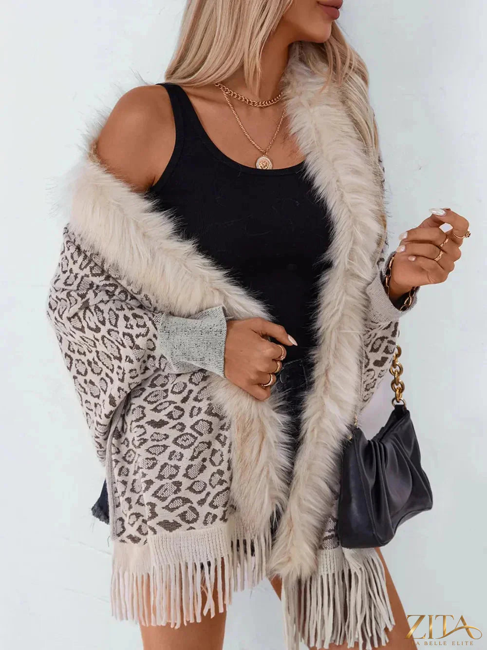 Leopard print fringe open front long sleeve poncho with tassel details, stylish and cozy, from Trendsi.