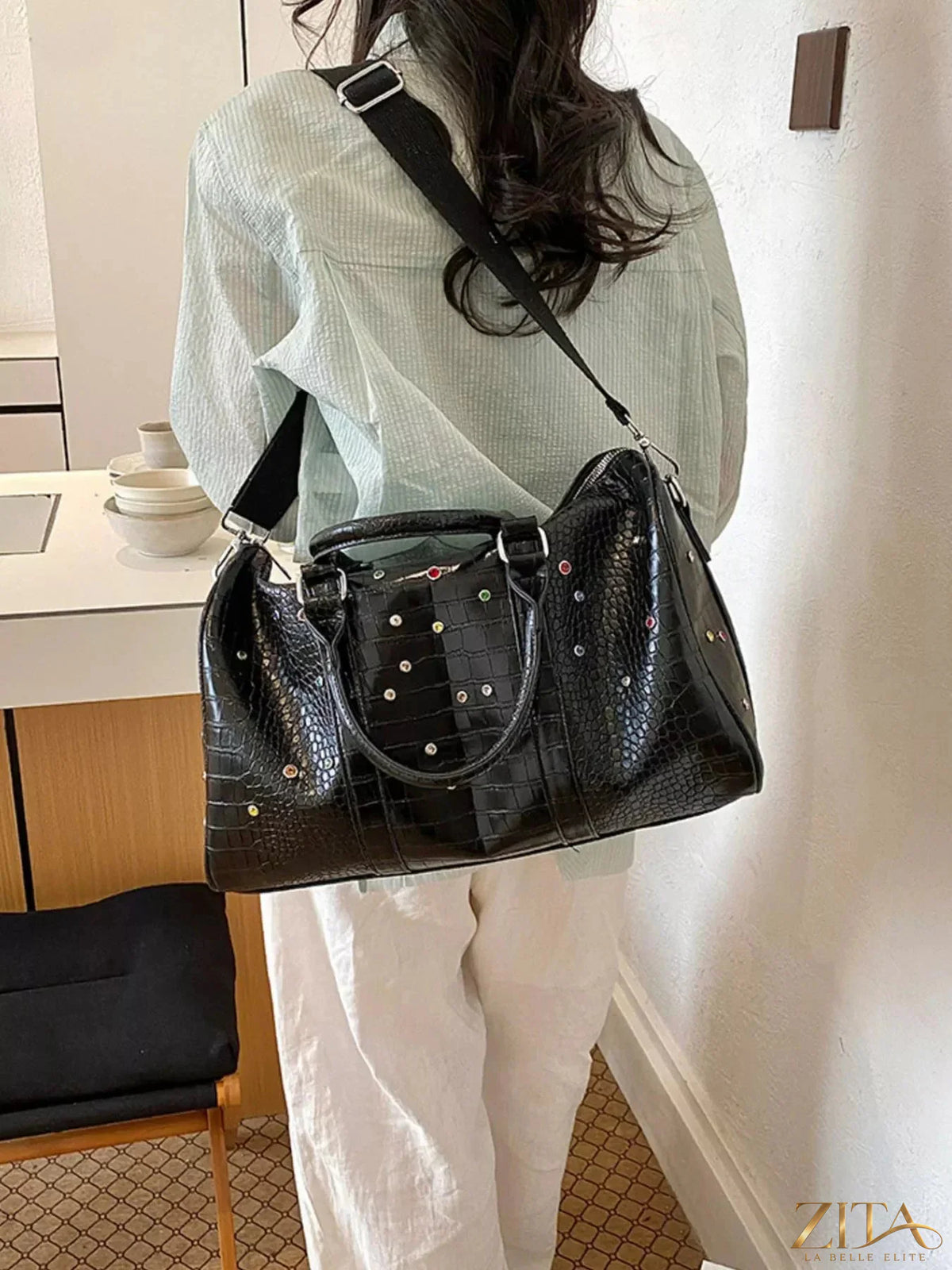 Crocodile embossed Zita La Belle Elite travel bag with studded accents, featuring sturdy handles and a spacious design for travel essentials.