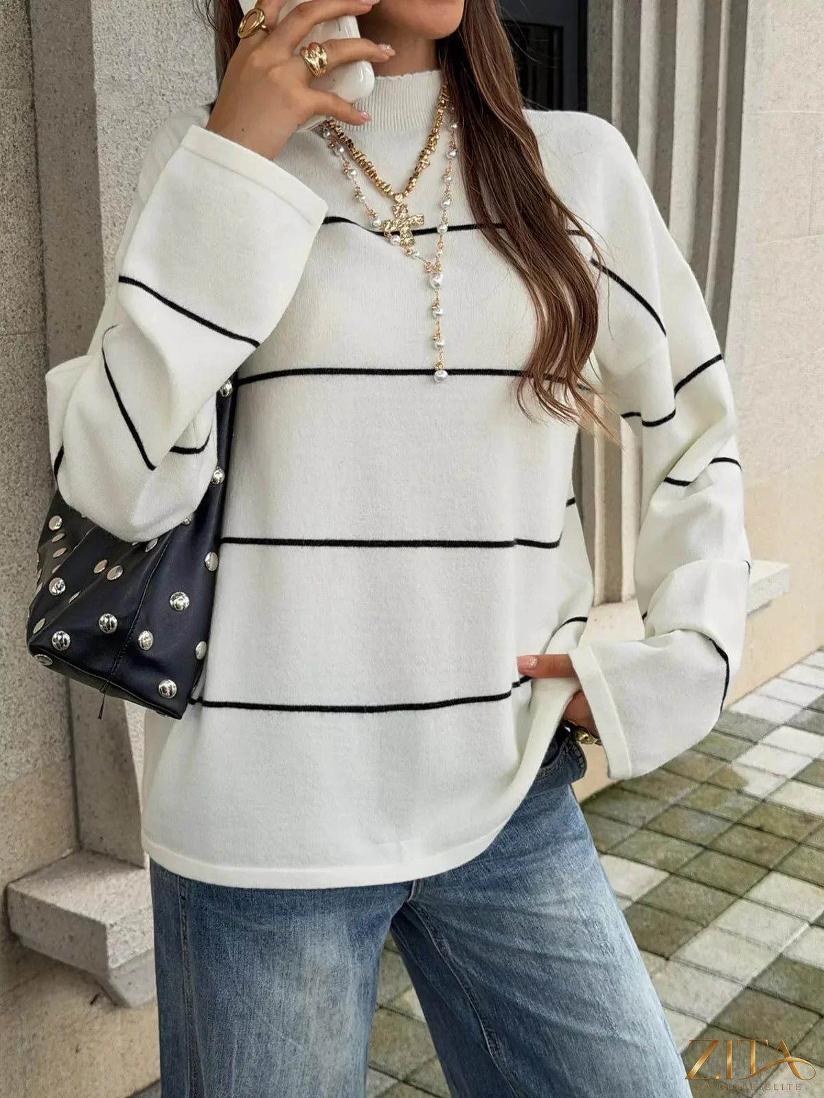 Zita La Belle Elite striped mock neck sweater featuring black and white horizontal stripes and a cozy, fitted design.