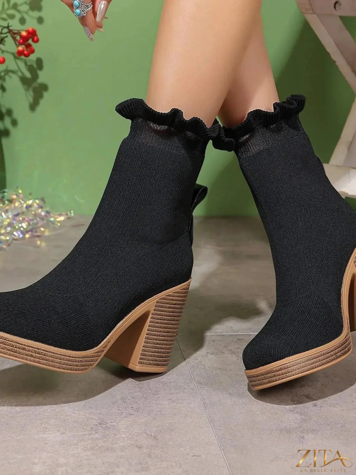 Zita La Belle Elite ruffled trim chunky heel boots showing black leather material and stylish ruffle details at the ankle.