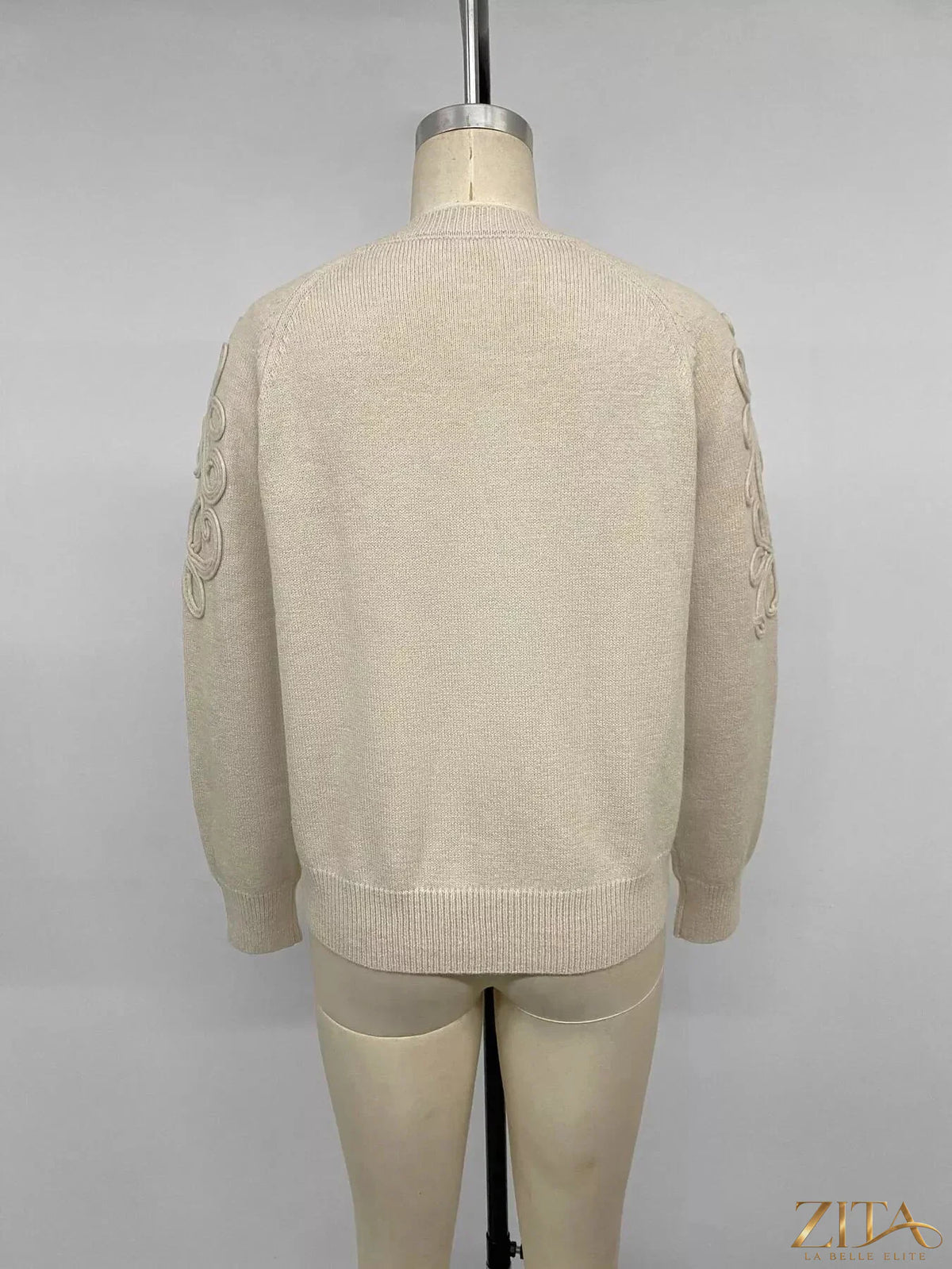Floral raglan sleeve sweater by Trendsi featuring a colorful floral pattern and cozy knit fabric.