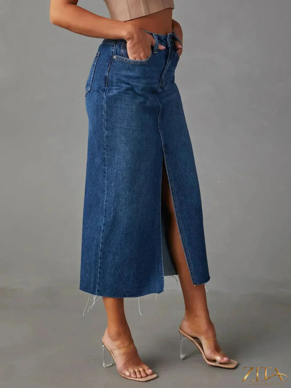 Raw hem front slit denim midi skirt by Zita La Belle Elite, showcasing its casual style and classic denim fabric.