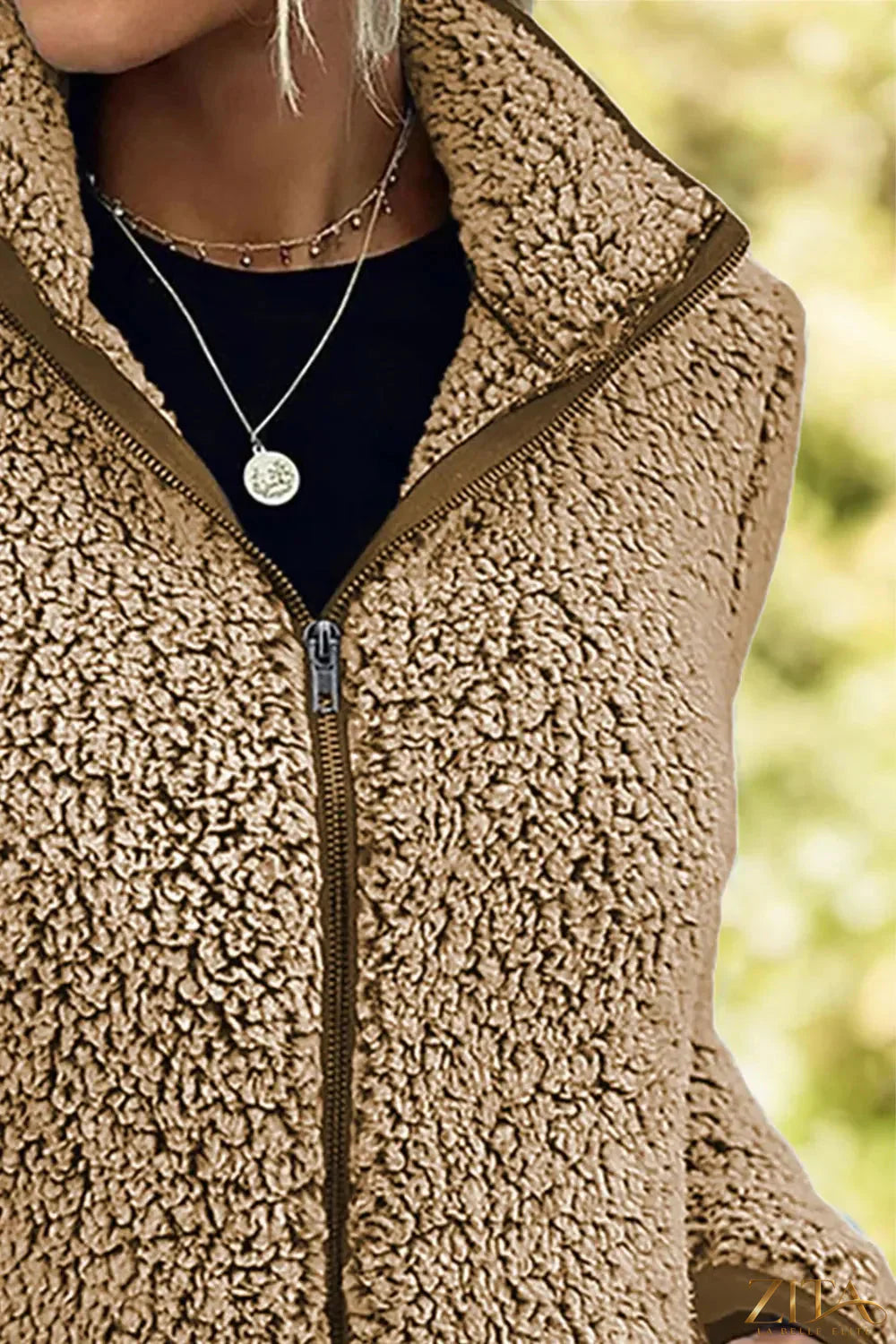 Trendsi pocketed zip-up turtleneck jacket with front pockets and fitted design, shown in black fabric.