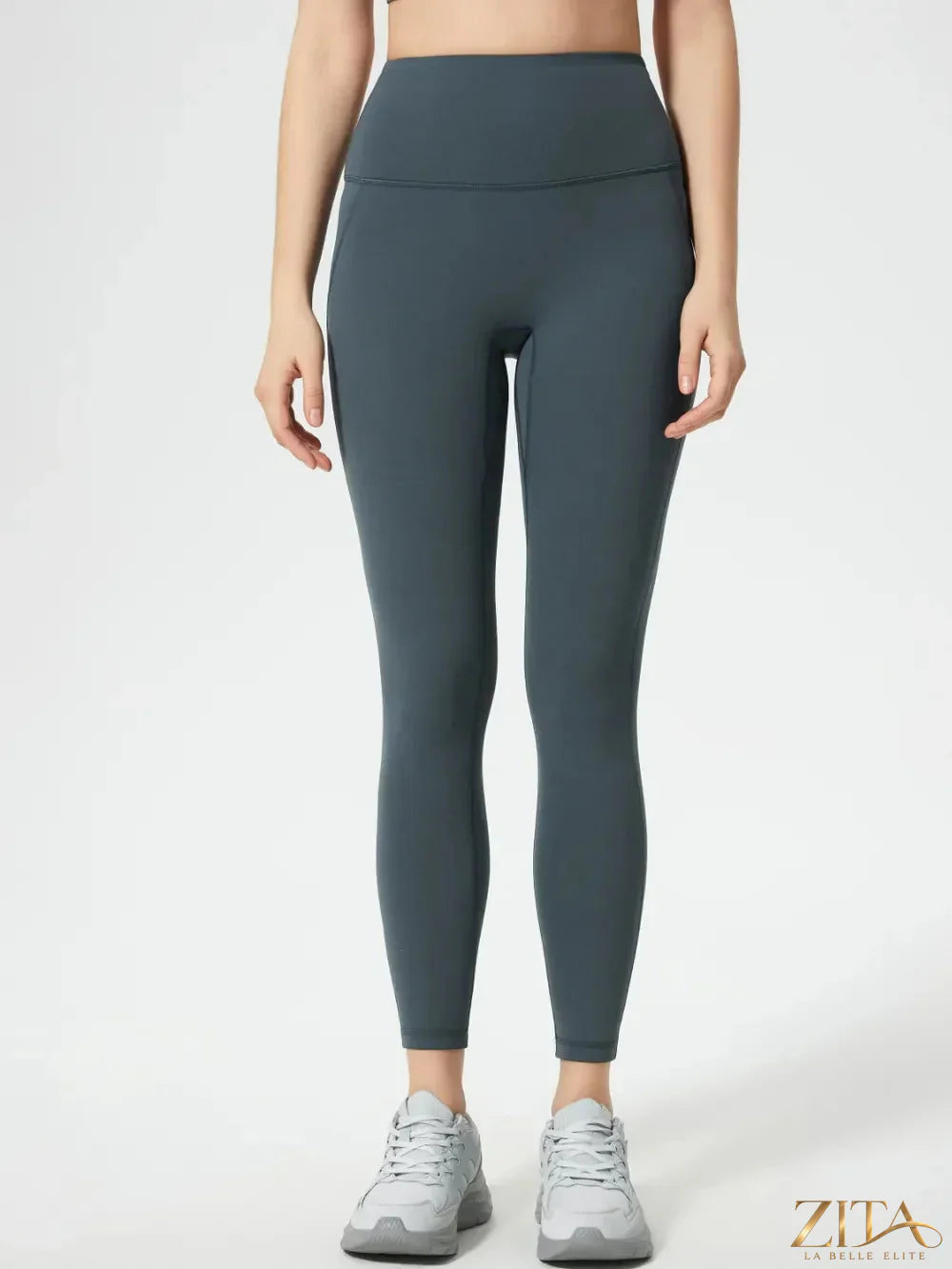 Trendsi Millennia wide waistband active leggings in black, showing a close-up of the high-rise design and stretchy fabric.
