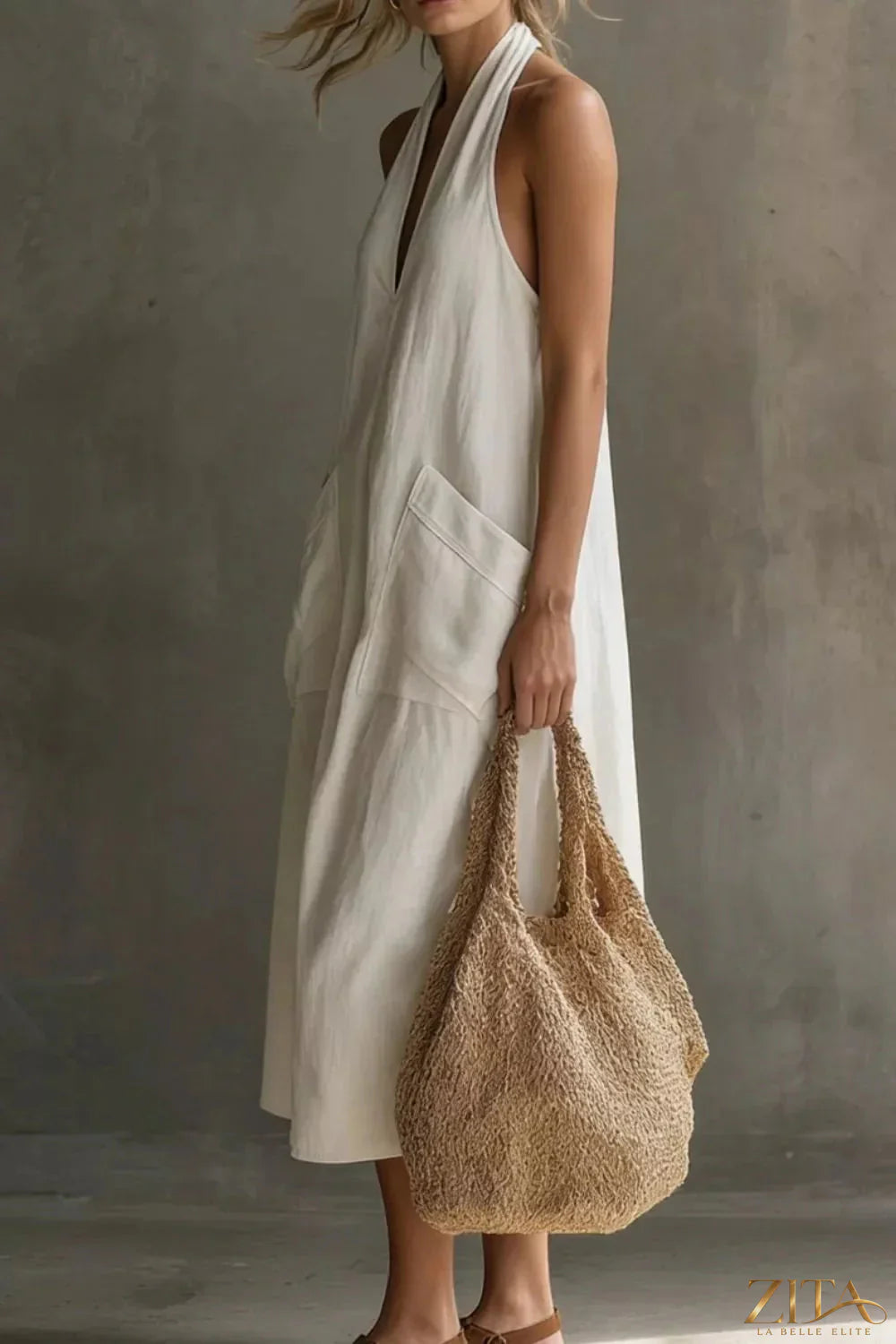 Casual halter neck pocket midi dress by Zita La Belle Elite, featuring a relaxed fit, sleeveless design, and side pockets.