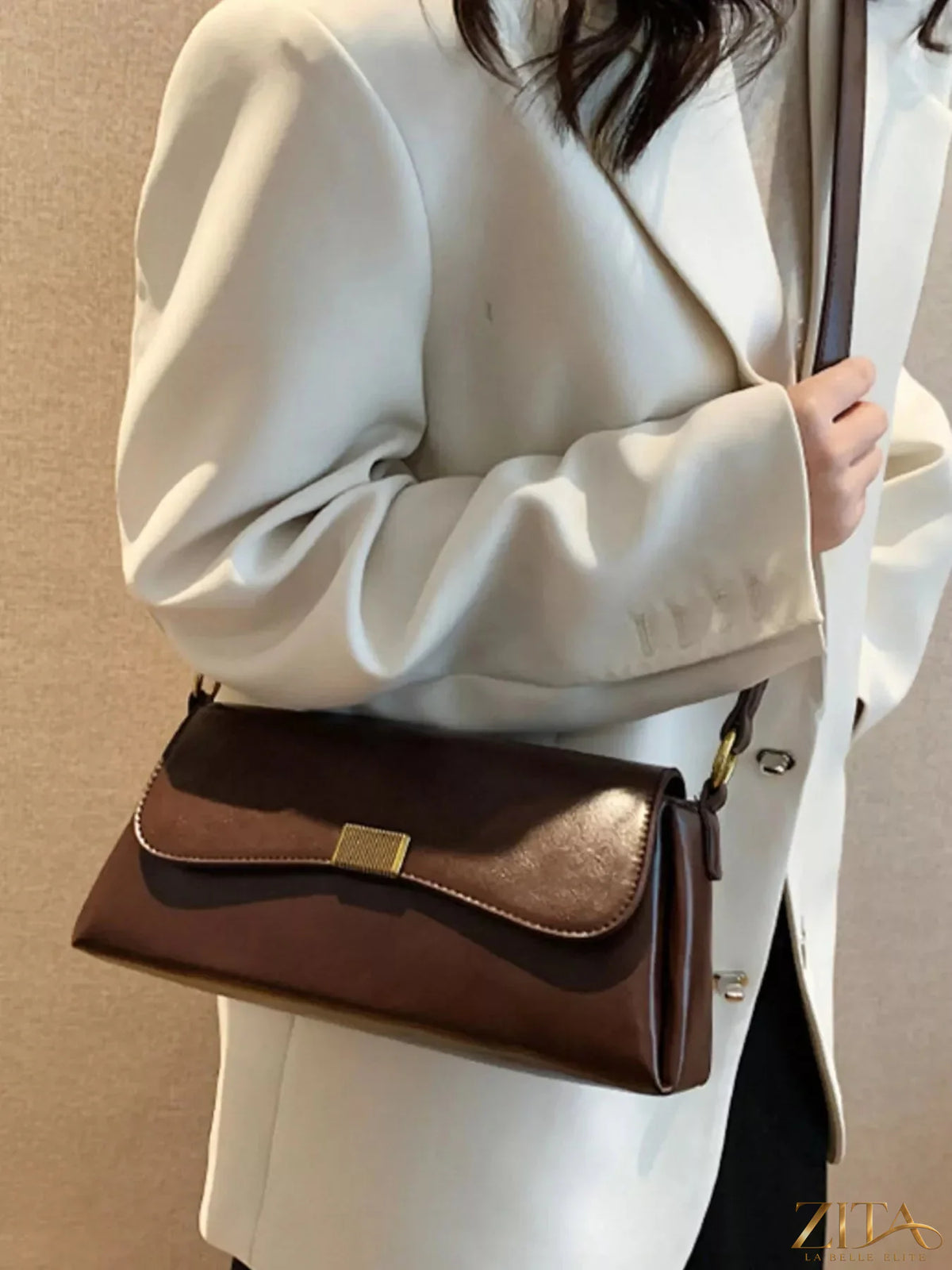 Leather flap shoulder bag by Trendsi with adjustable strap and spacious interior, showcasing its stylish design and high-quality leather.