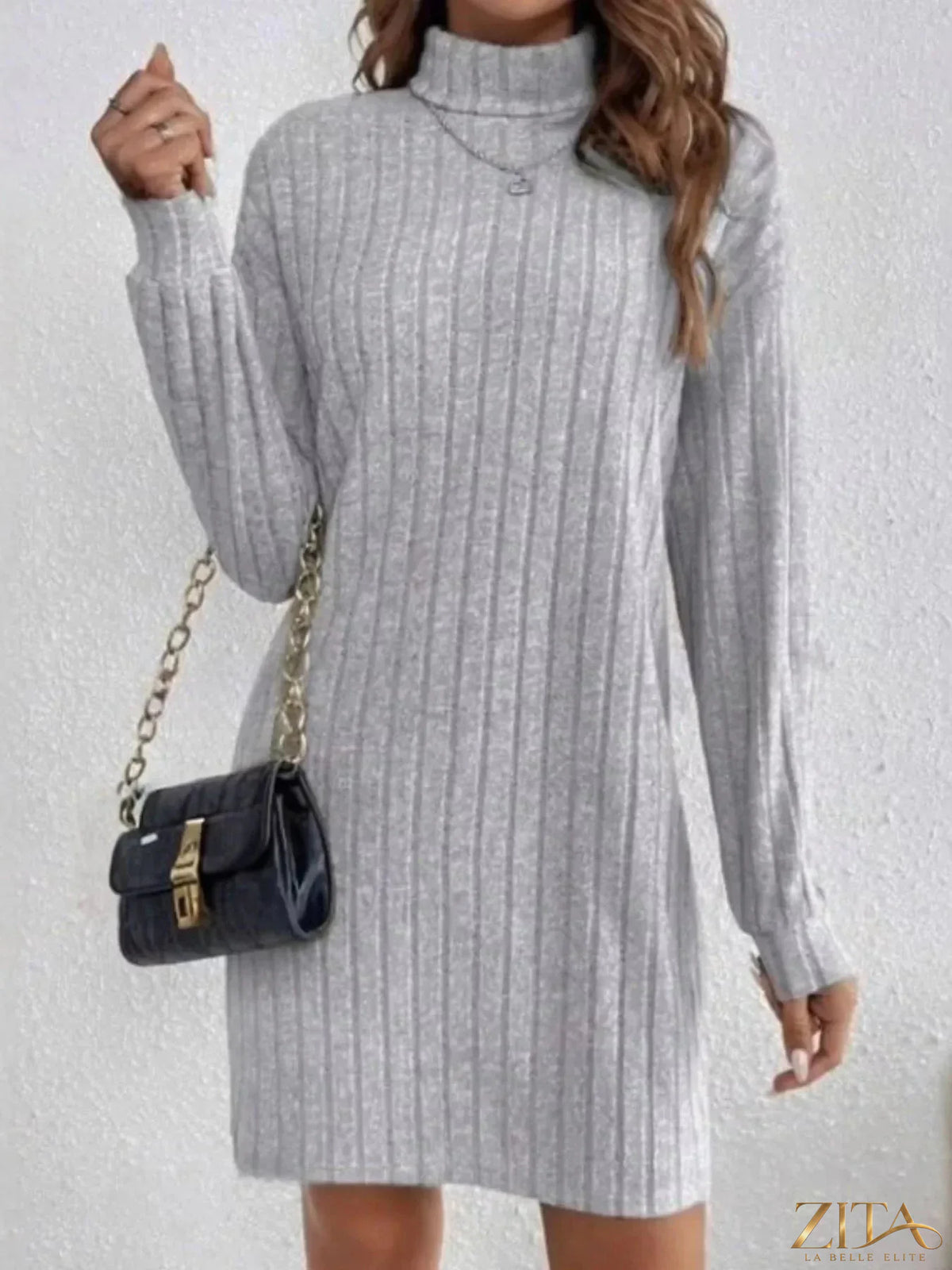 Casual ribbed turtleneck long sleeve mini dress by Trendsi, featuring a fitted silhouette and textured fabric in a neutral color.