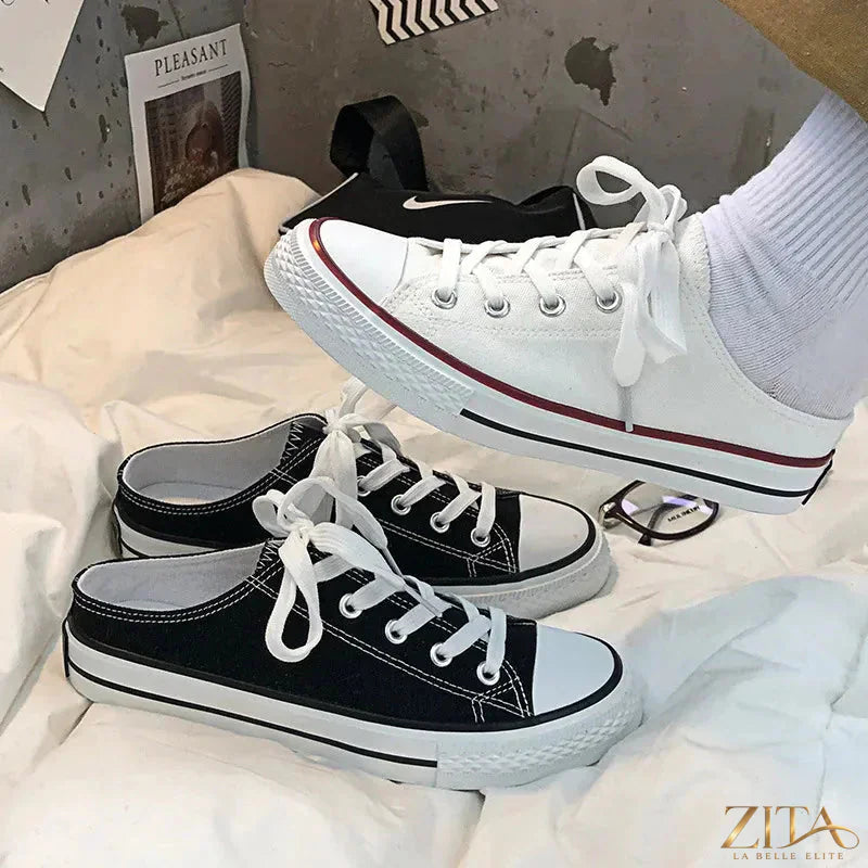 Zita La Belle Elite round toe lace-up canvas sneakers showing white shoes with white laces on a plain background.