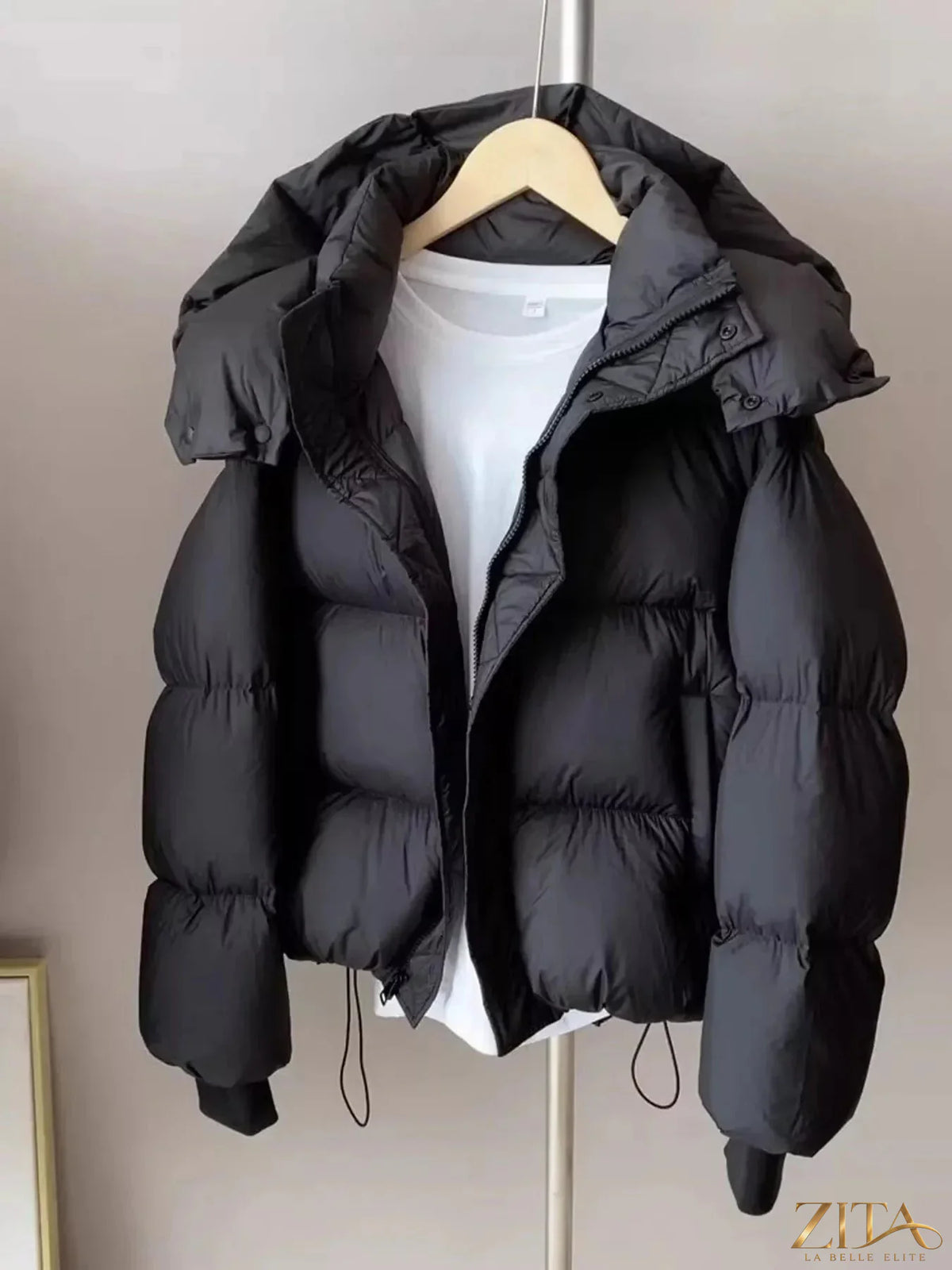 Zita La Belle Elite quilted hooded puffer jacket with insulated design and front zipper, shown in a stylish quilted fabric.