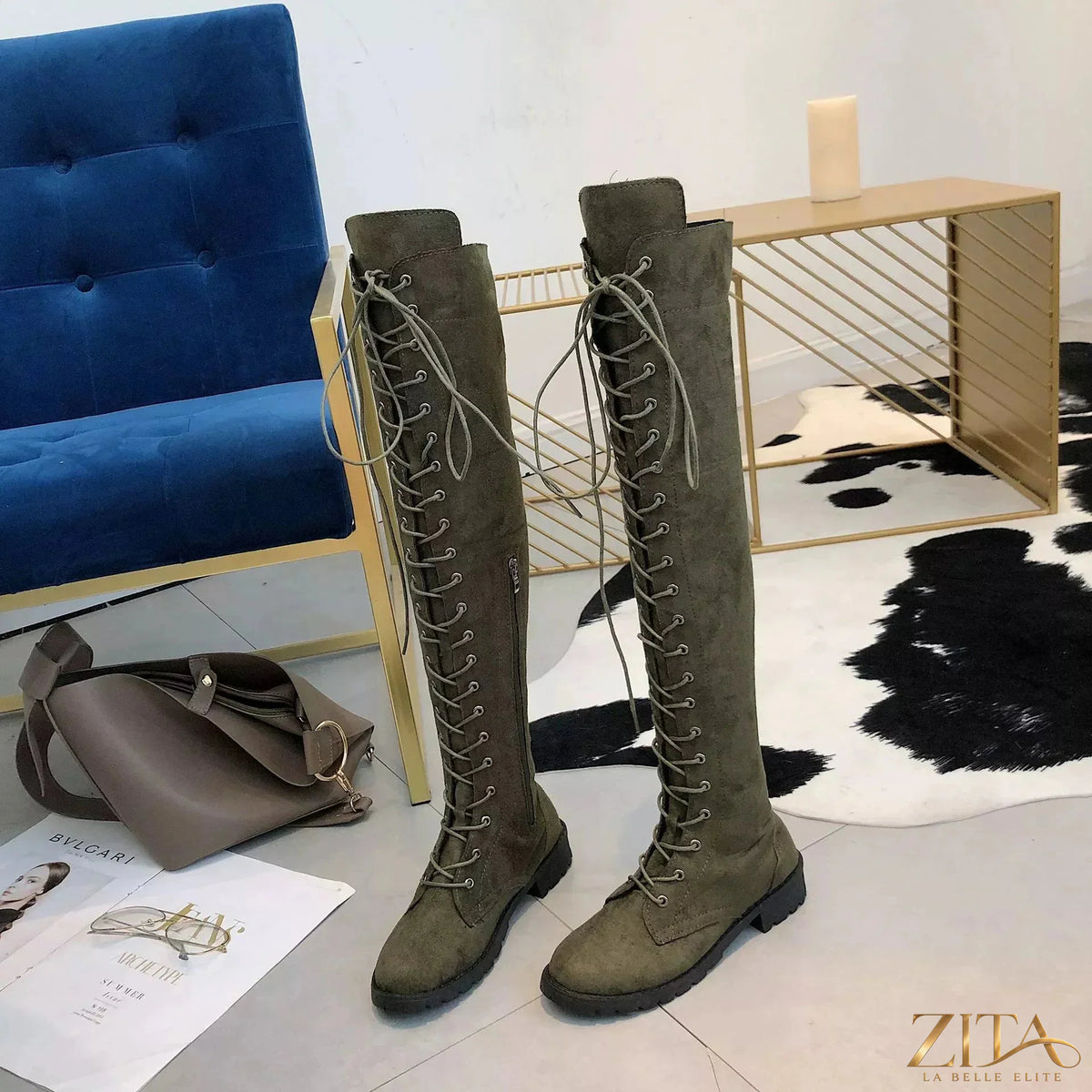 Over-the-knee lace-up boots by Trendsi featuring black faux leather and chunky platform heels, styled with a casual outfit.