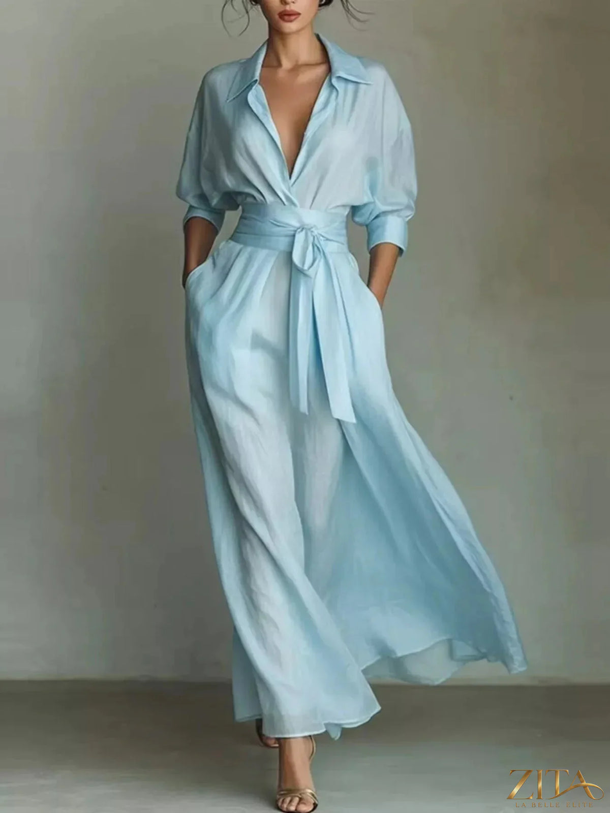 Maxi shirt dress with waist-defining sash, flowing fabric, and stylish design by Trendsi.