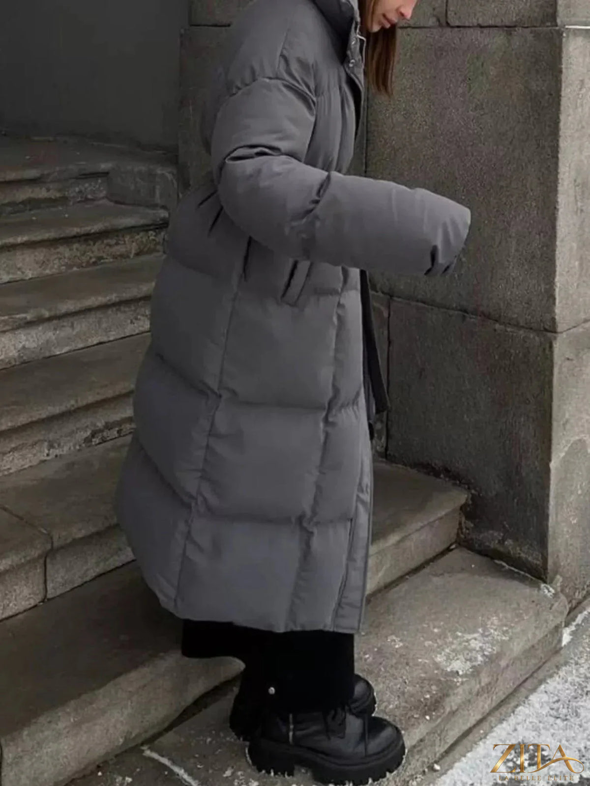 Longline padded winter coat with belt from Zita La Belle Elite, featuring a warm, insulated design and stylish silhouette.