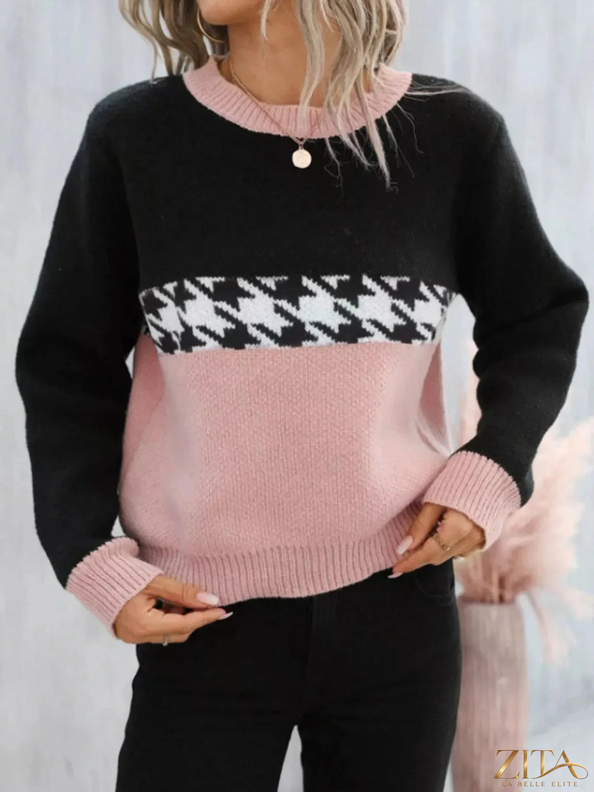 Color block houndstooth sweater from Trendsi featuring bold black and white pattern, long sleeves, and cozy knit fabric.