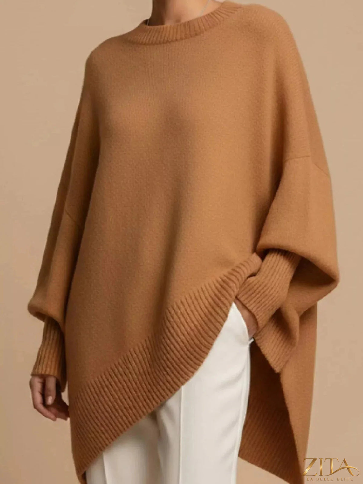 Oversized dropped shoulder sweater in soft knit fabric, stylish and cozy, from Trendsi, shown in a neutral color.