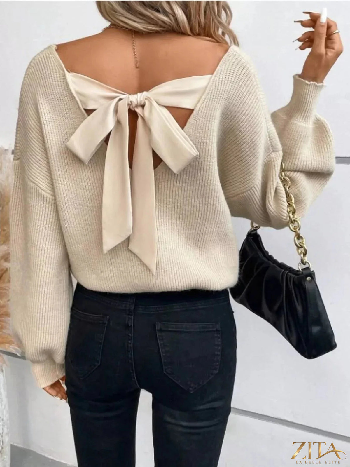 Zita La Belle Elite back bow V-neck sweater featuring a stylish bow detail and fitted V-neck design in soft knit fabric