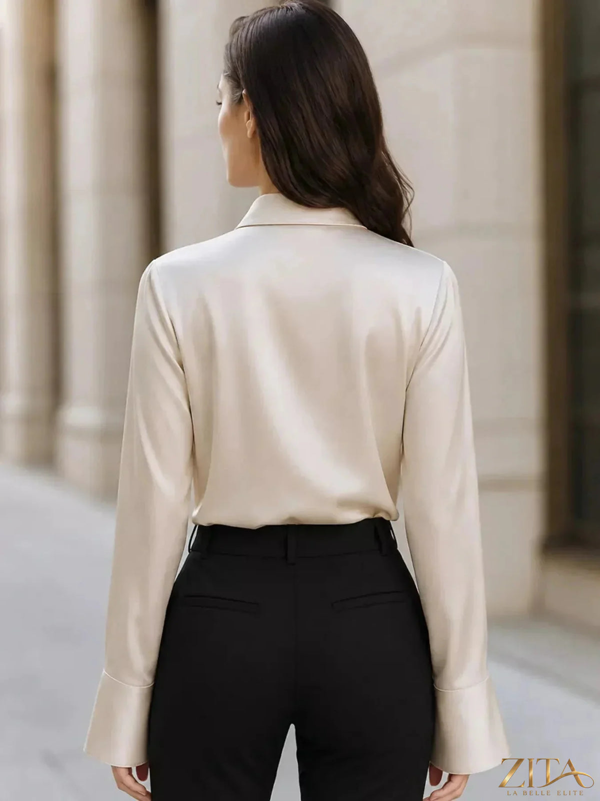 Zita La Belle Elite asymmetric collar satin blouse with long sleeves and elegant drape, showcased on a white background.