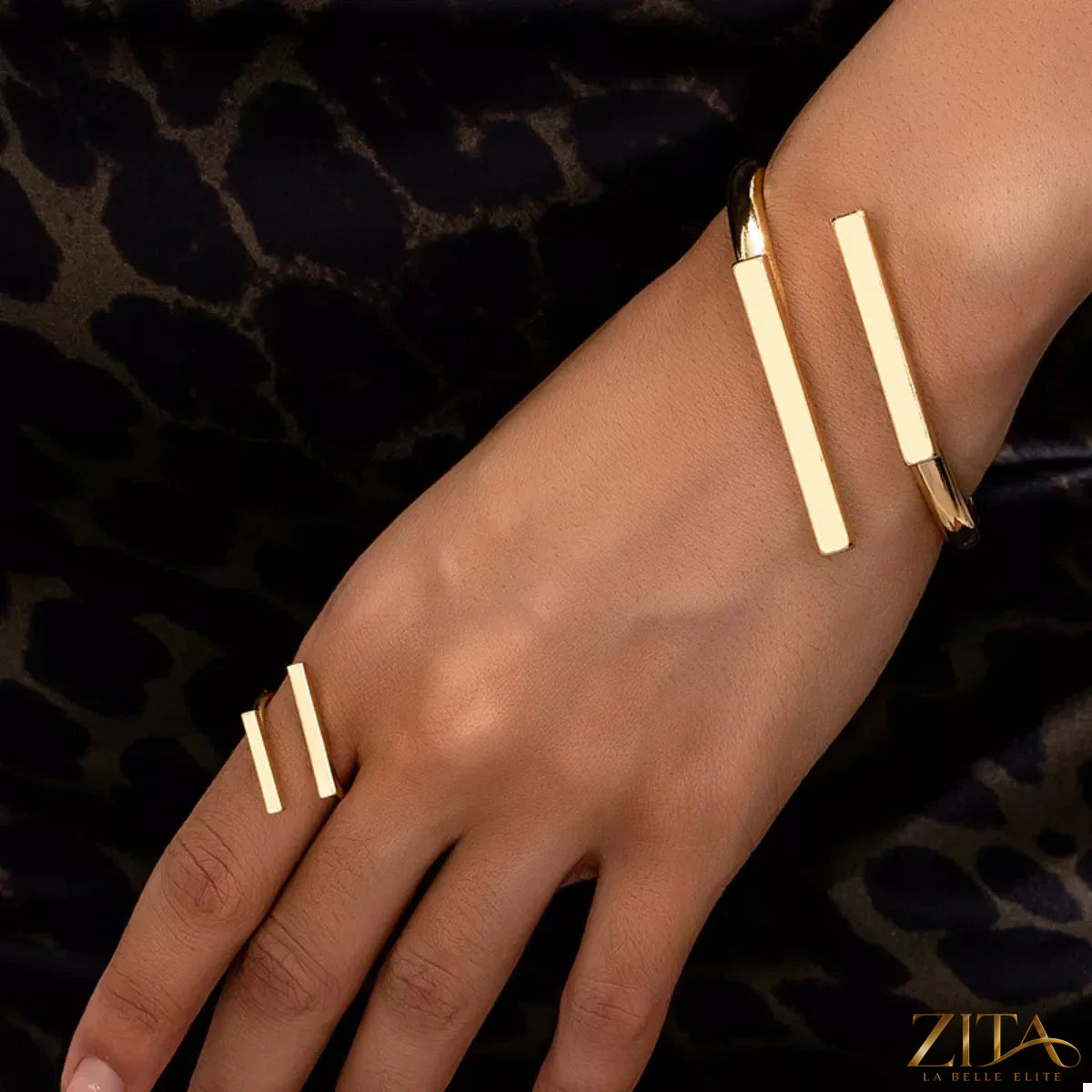 Adjustable 18K gold-plated modern bar bracelet and ring jewelry set with sleek, minimalist design on a white background.
