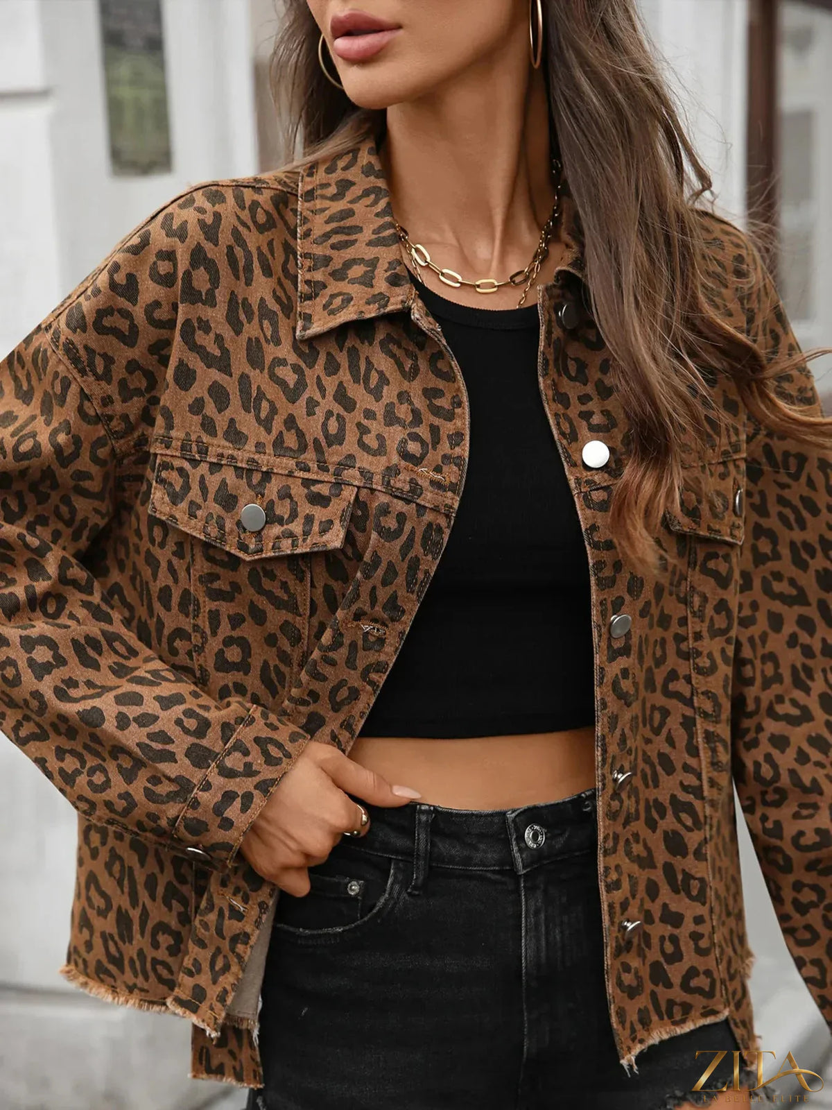 Zita La Belle Elite leopard print raw hem denim jacket displayed on a hanger, showcasing its bold pattern and distressed style.