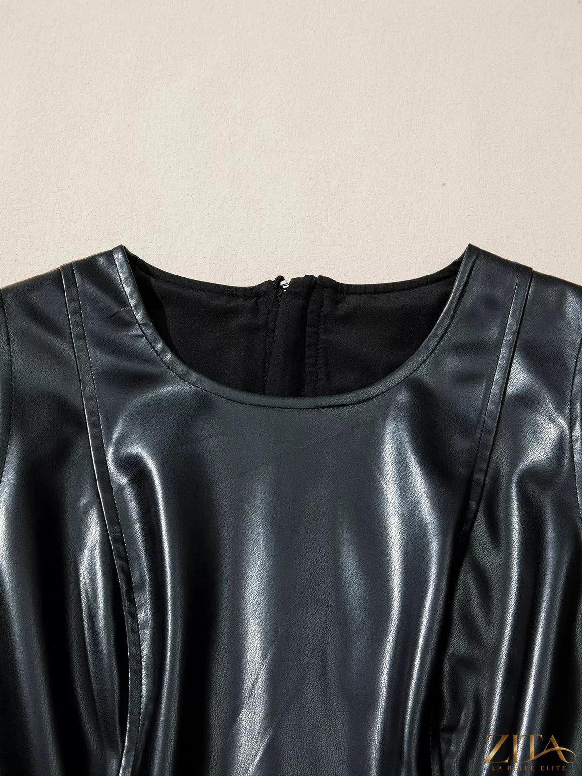 Zita La Belle Elite faux leather sleeveless mini dress with ruffle hem, stylish and fitted, perfect for modern fashion looks.
